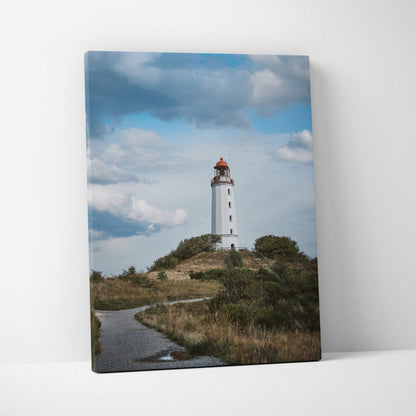 Majestic lighthouse on hill under cloudy sky coastal canvas wall art print.