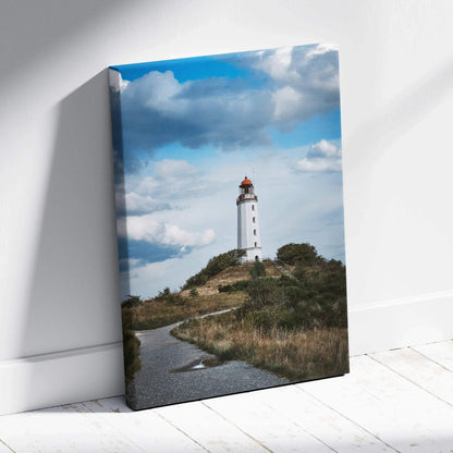 Majestic coastal lighthouse on hill under blue sky canvas wall art print.