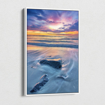 Canvas wall art of a tranquil beach sunset with soft waves and colorful sky.