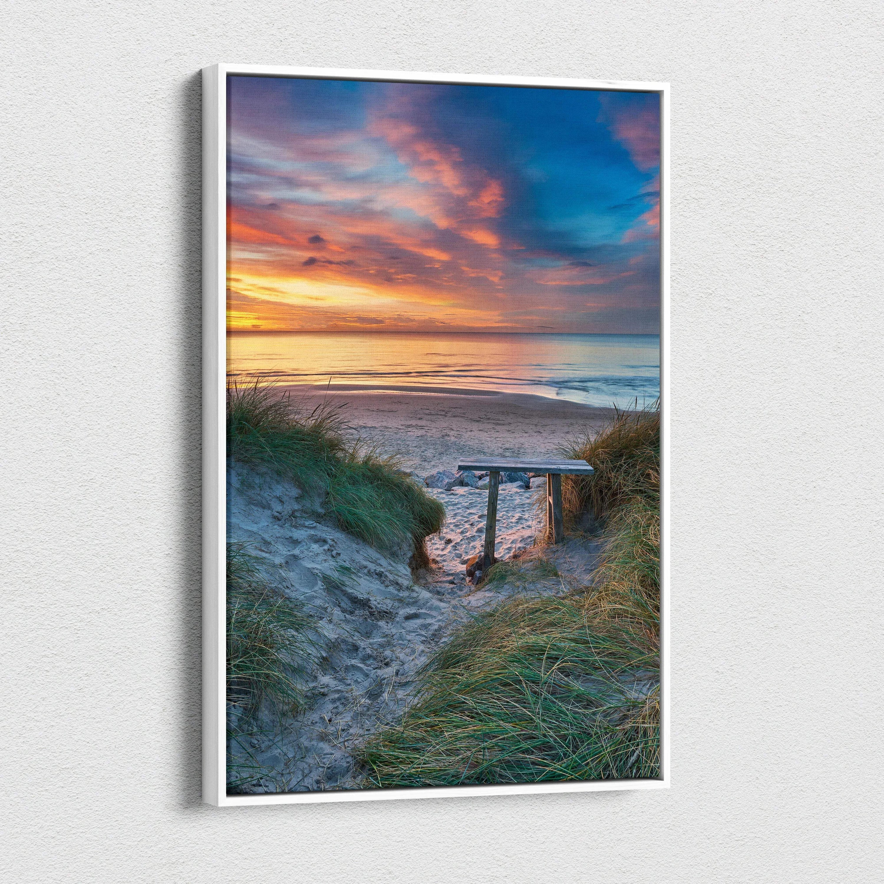 Vertical canvas wall art featuring a serene beach sunset with vibrant clouds and sand dunes.