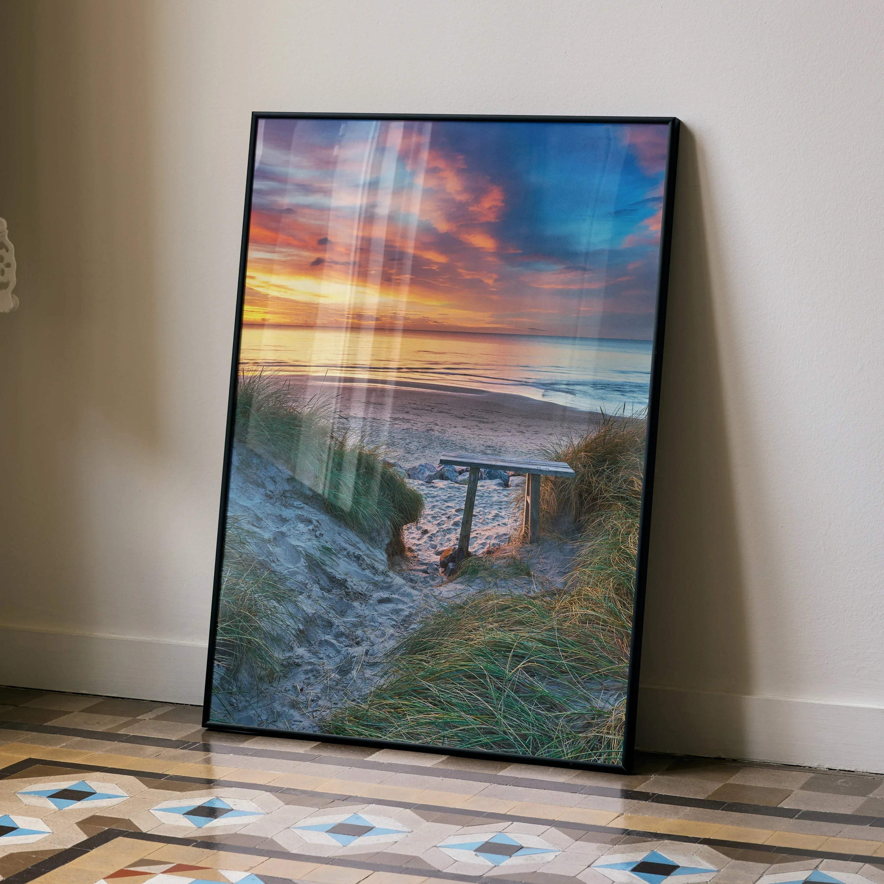 Vibrant beach sunset ocean poster with colorful sky and sandy path wall art in black frame.