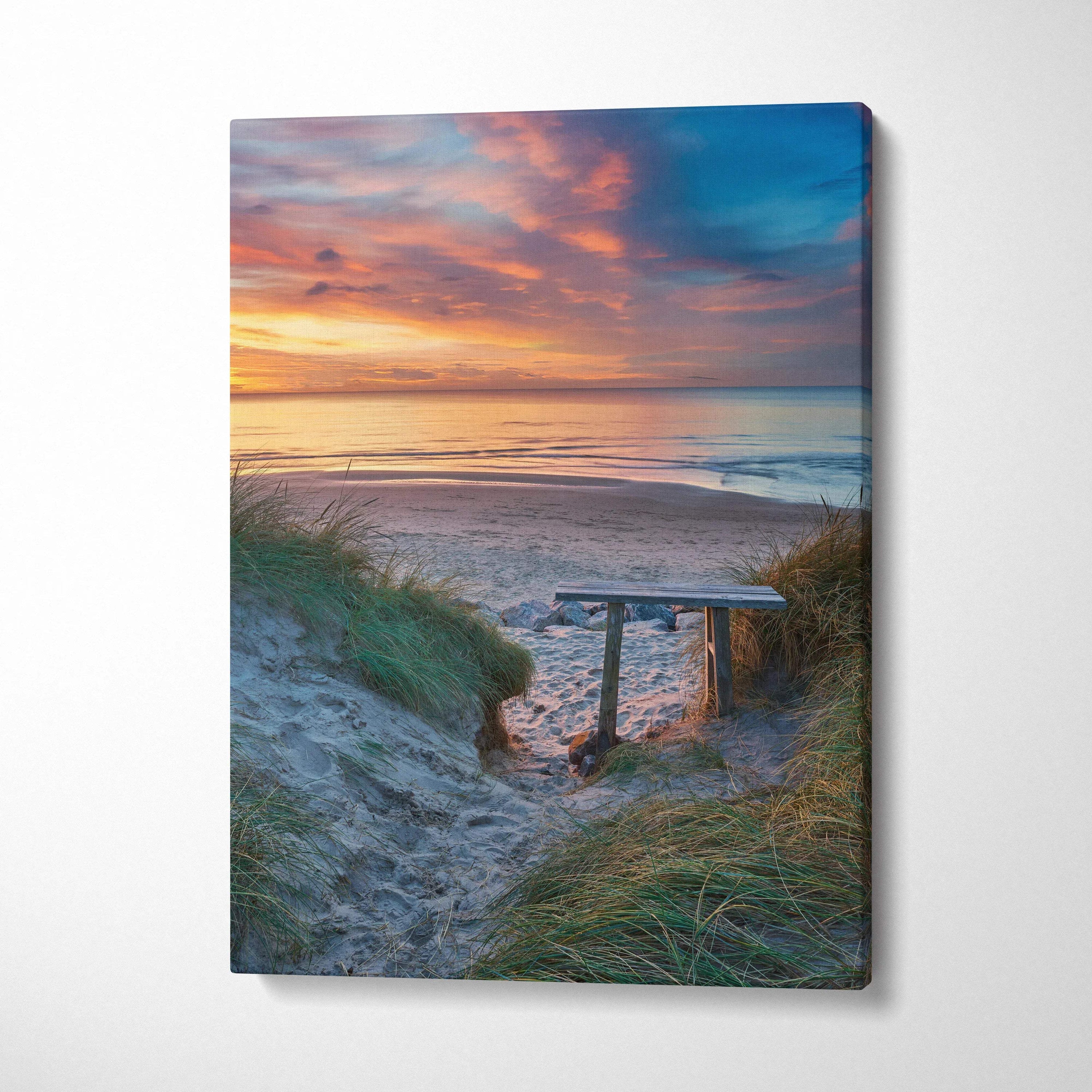Sunset beach scene with sandy path and grassy dunes on canvas wall art print.