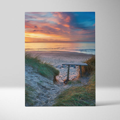 Canvas wall art of a serene beach sunset with soft sand dunes and calm ocean waters.