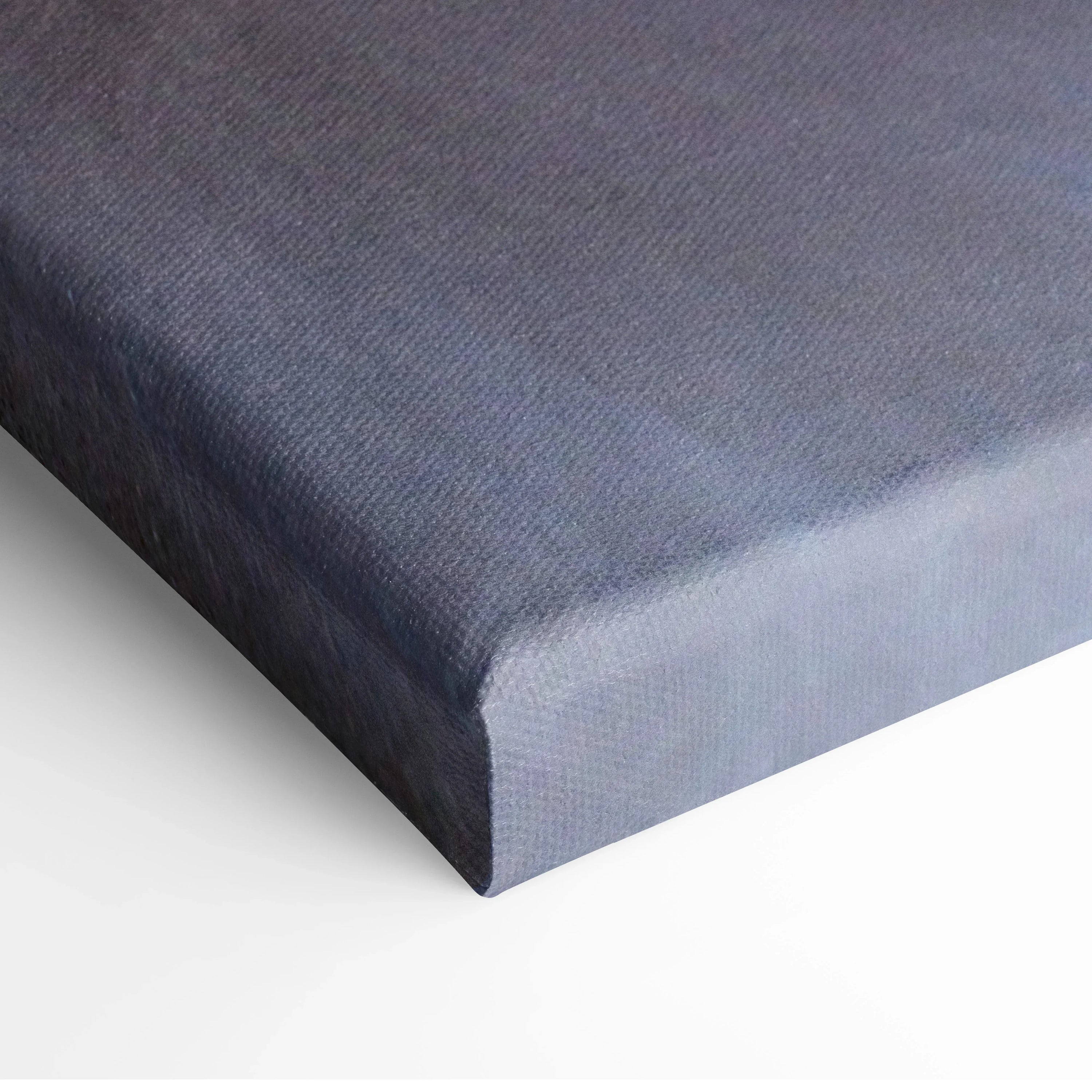 Close-up of serene blue and gray beach sunset canvas wall art with smooth texture and wrapped edges.