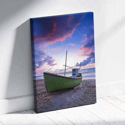 Canvas wall art featuring a green boat on a beach under a vibrant sunset sky.