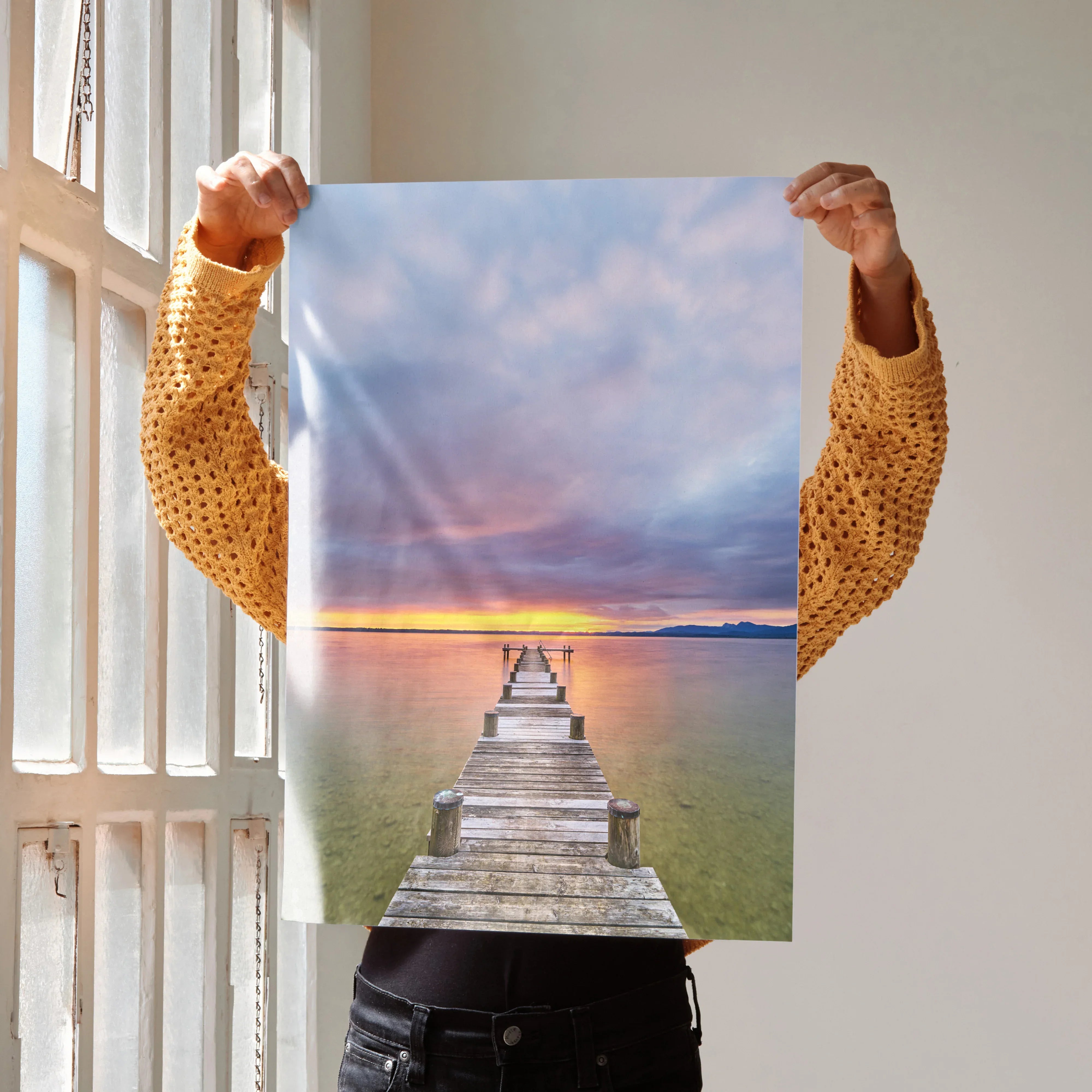 Serene beach sunset poster featuring a wooden pier extending into calm ocean water, vibrant sky colors, vertical wall art.