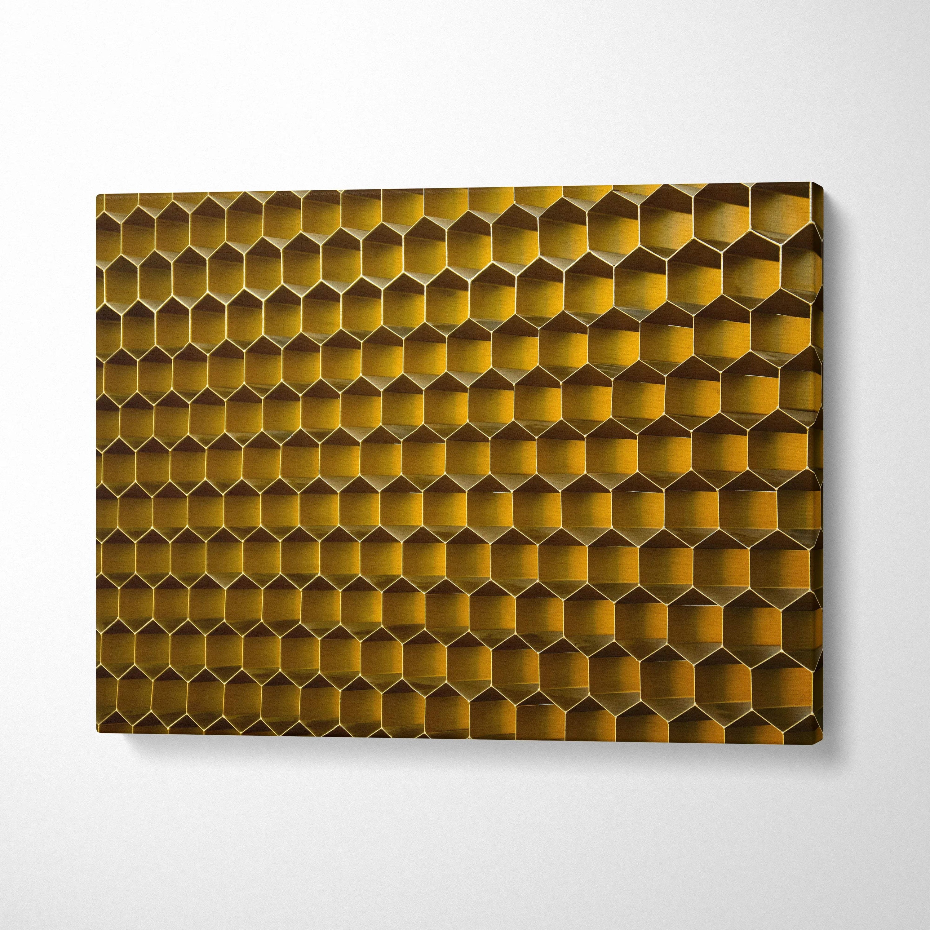 Golden honeycomb wall art panel in amber and gold tones on canvas