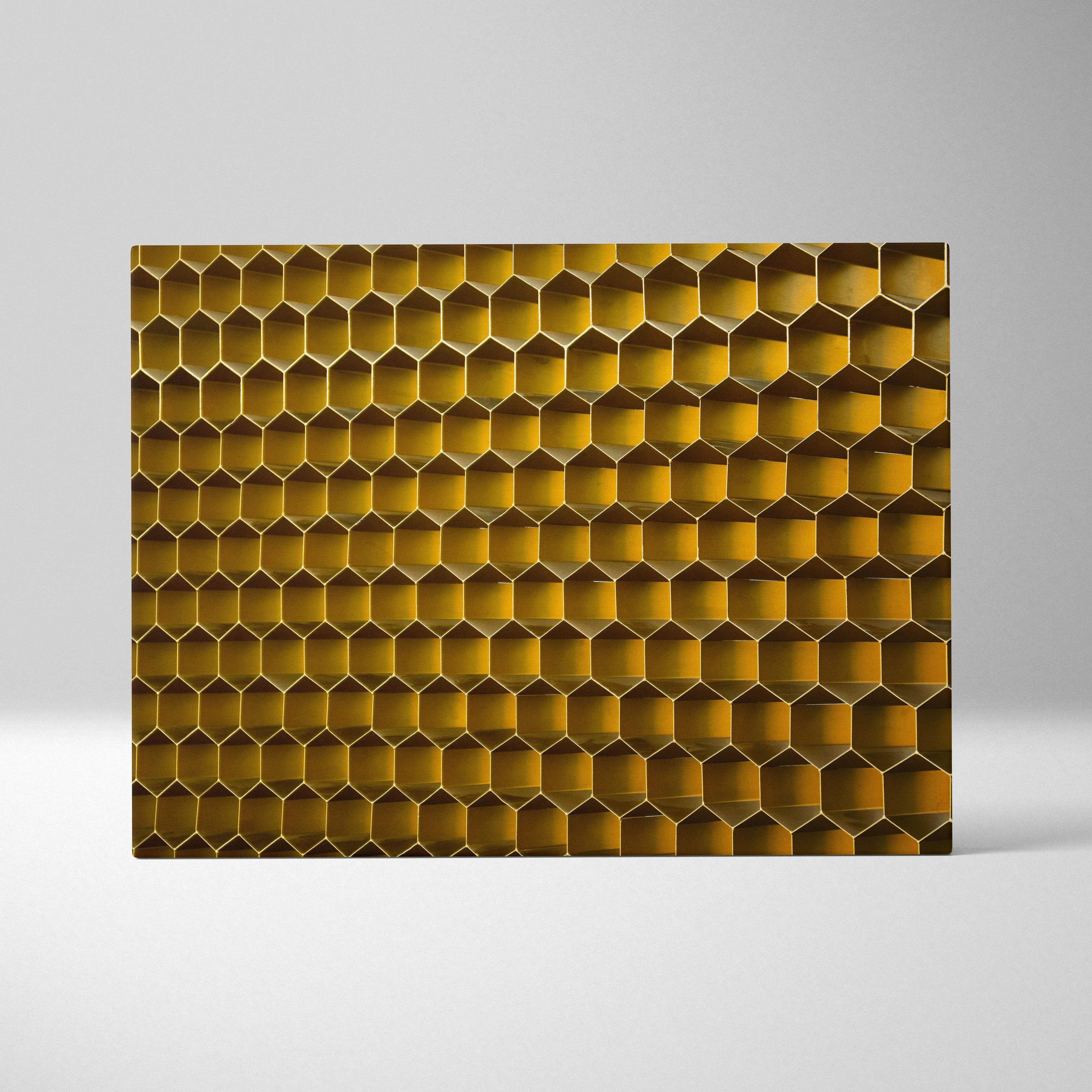 Golden honeycomb metal wall panel in warm amber gold tones