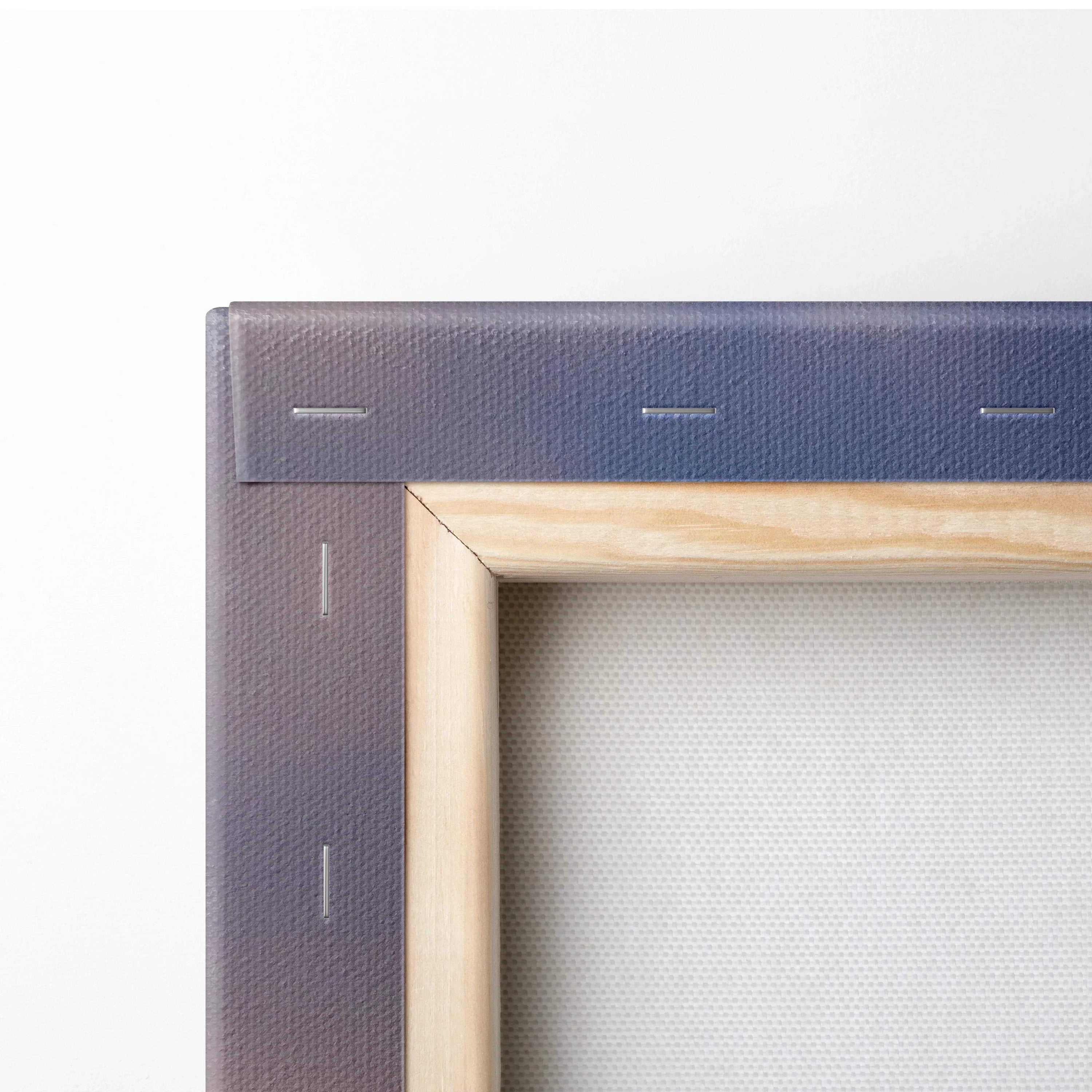 Close-up of wooden frame corner on stretched canvas for wall art print.