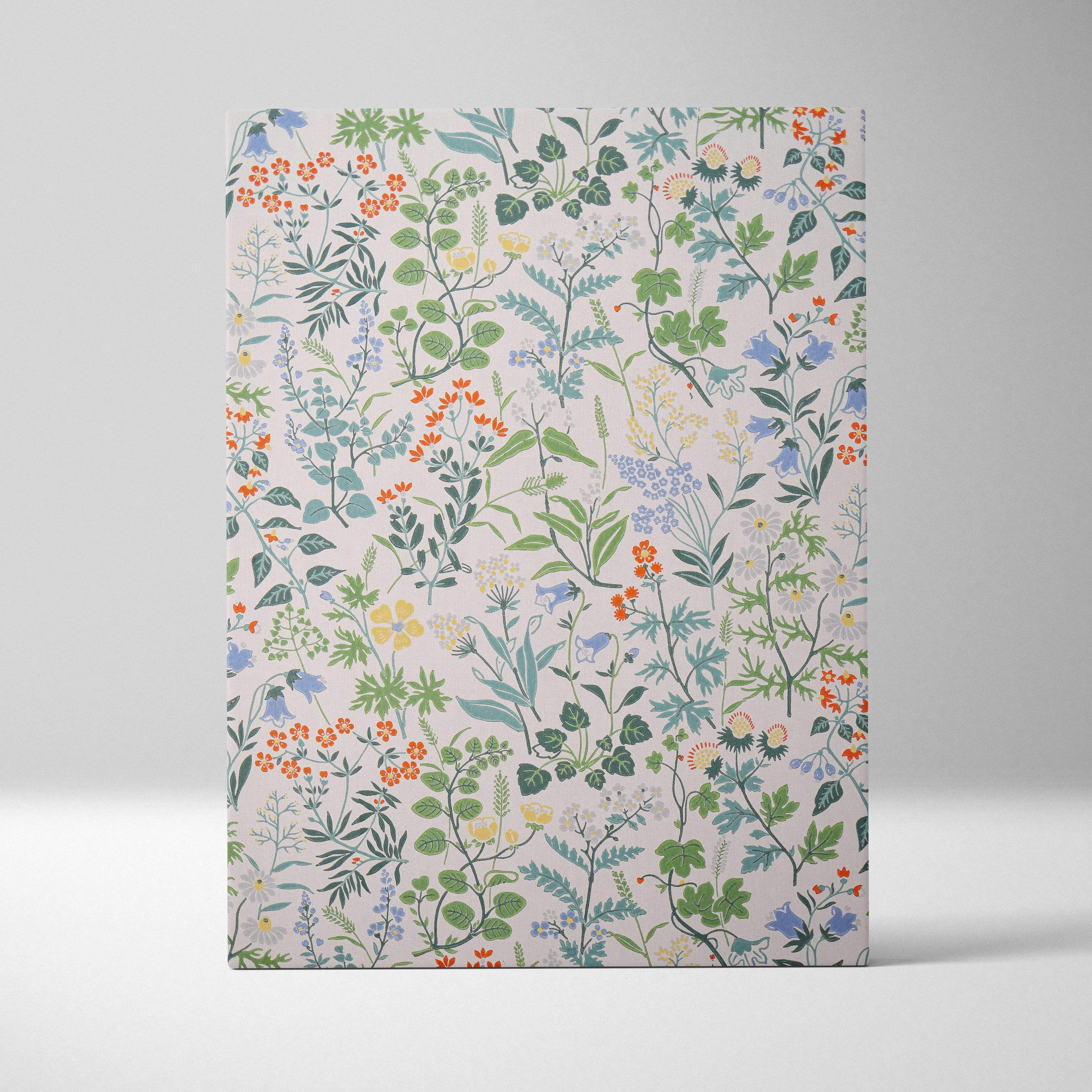 Vintage botanical floral notebook with pink cover, green leaves, colorful flowers