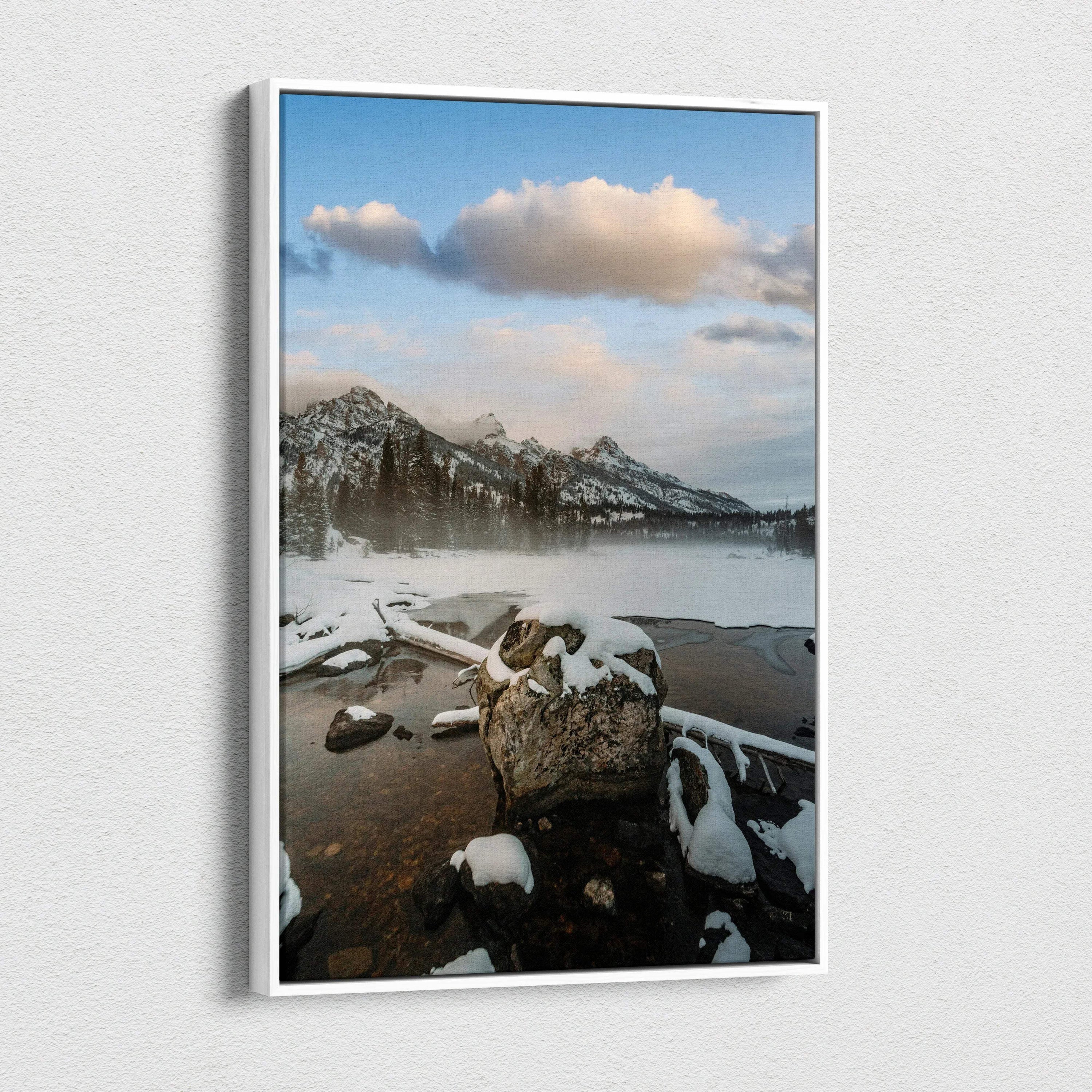 Vertical canvas wall art featuring snow-capped mountains and a serene lake under a cloudy sky.