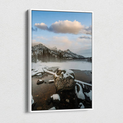 Vertical canvas wall art featuring snow-capped mountains and a serene lake under a cloudy sky.