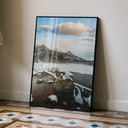 Vertical poster of snowy mountain range with lake and cloudy sky, nature wall art.