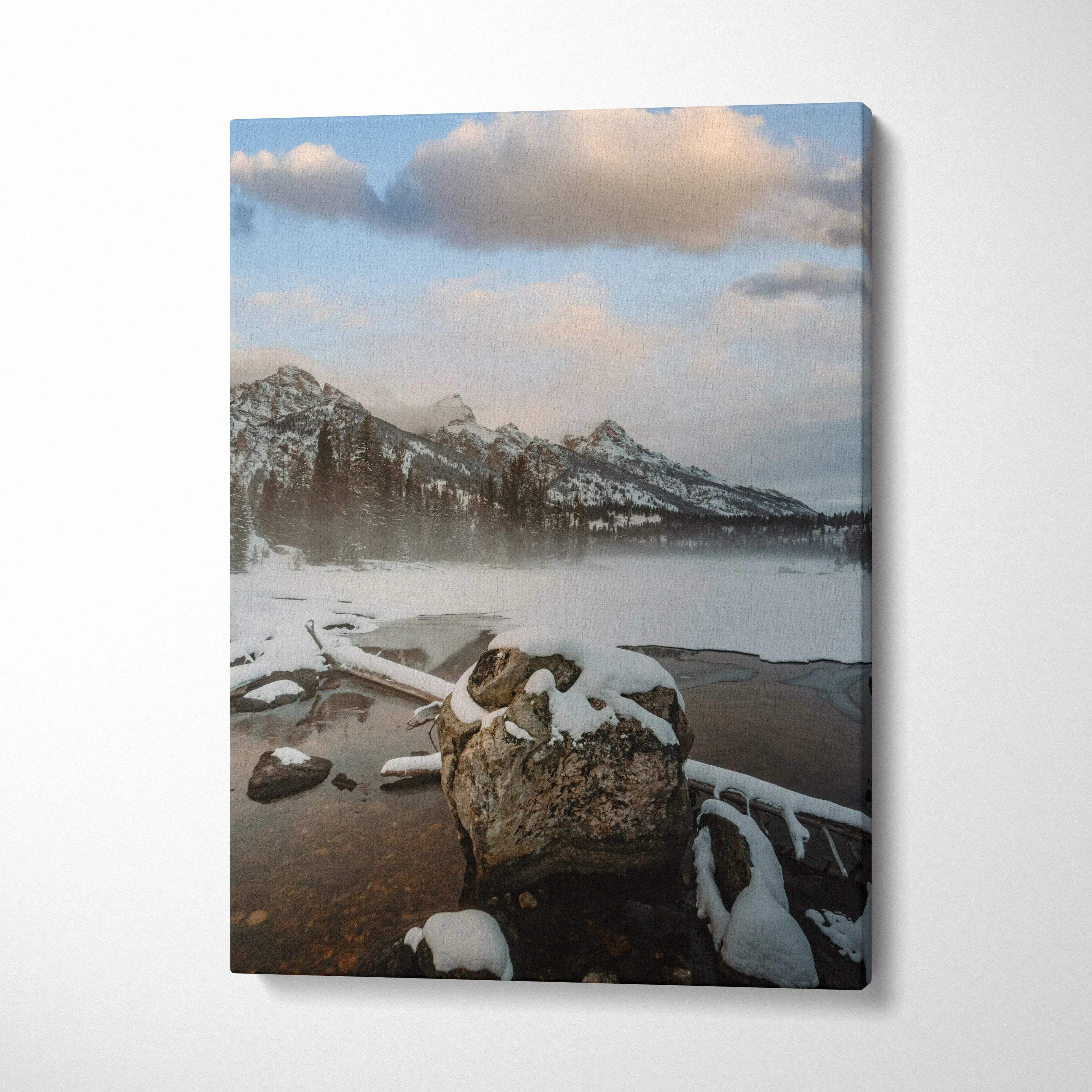Snow-capped mountain canvas wall art with misty lake and large foreground rock.