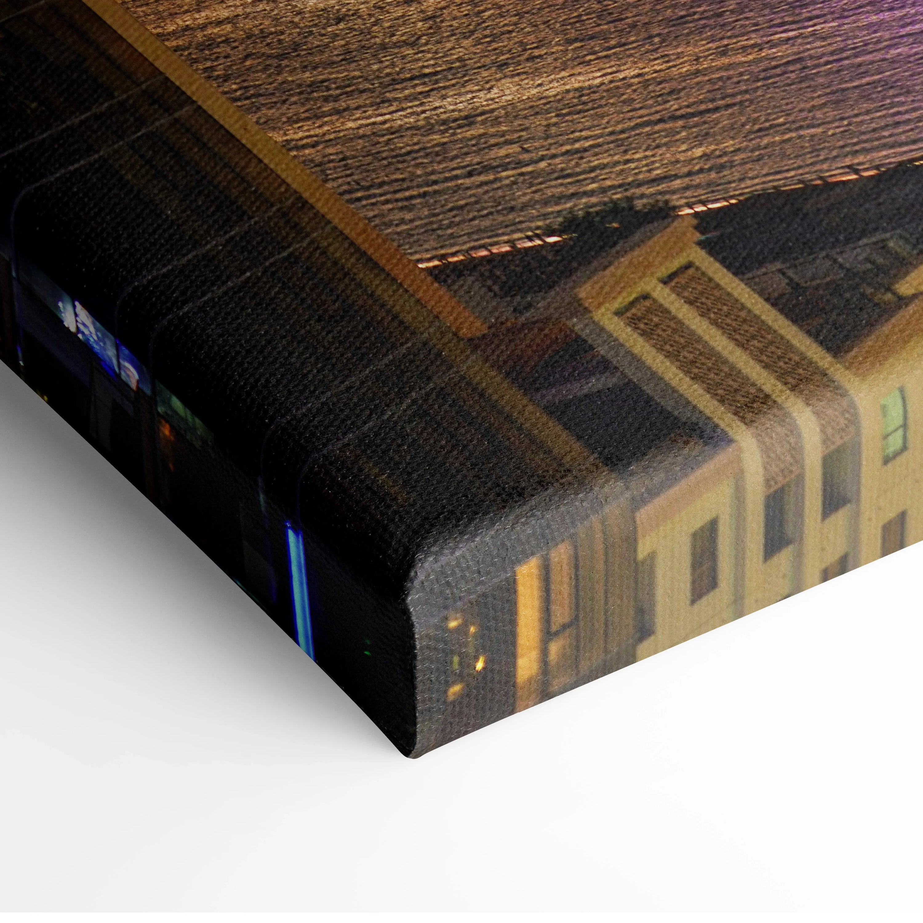 Canvas wall art featuring vibrant sunset cityscape with illuminated buildings and glowing sky.