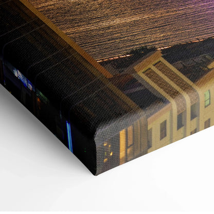 Canvas wall art featuring vibrant sunset cityscape with illuminated buildings and glowing sky.