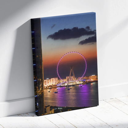Vibrant sunset cityscape canvas wall art featuring illuminated Ferris wheel by waterfront buildings.
