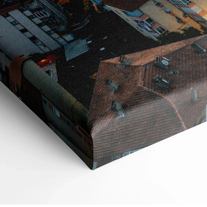 Cityscape canvas wall art showing vibrant sunset over urban buildings with detailed rooftops.