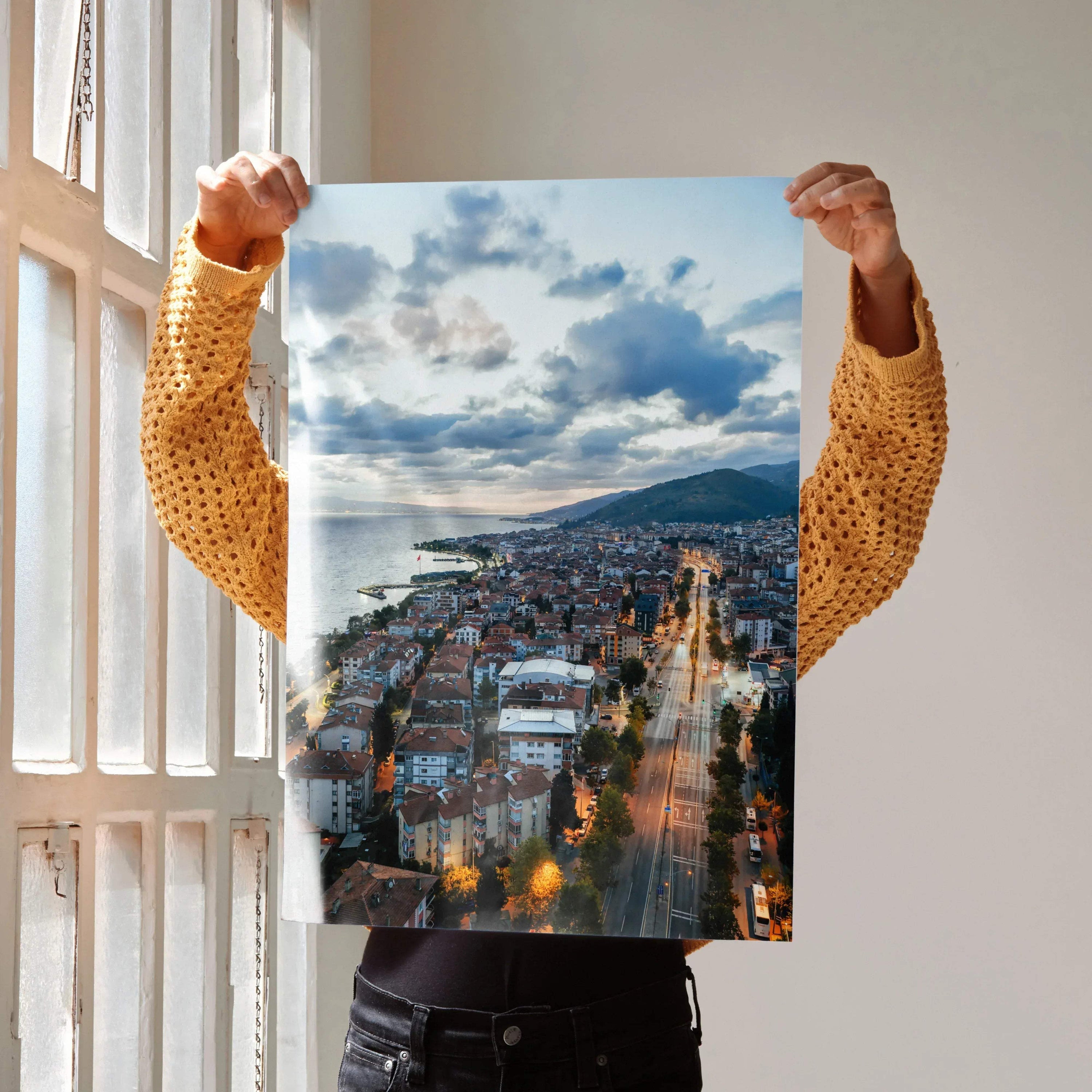 Vertical vibrant city sunset poster featuring glowing streetlights and dramatic clouds for wall art.