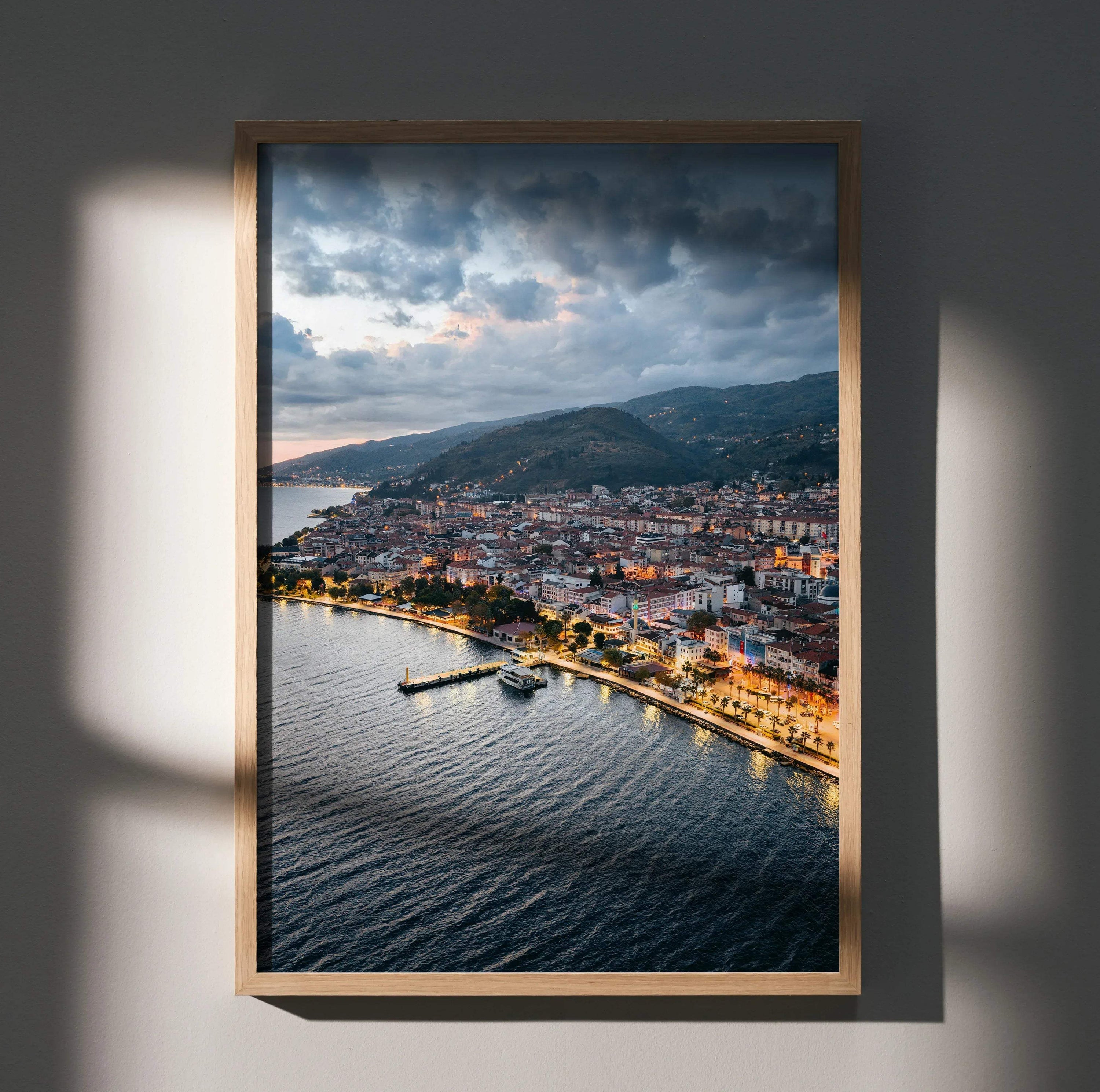 Vertical city sunset wall art poster featuring coastal skyline with dramatic clouds and evening lights.