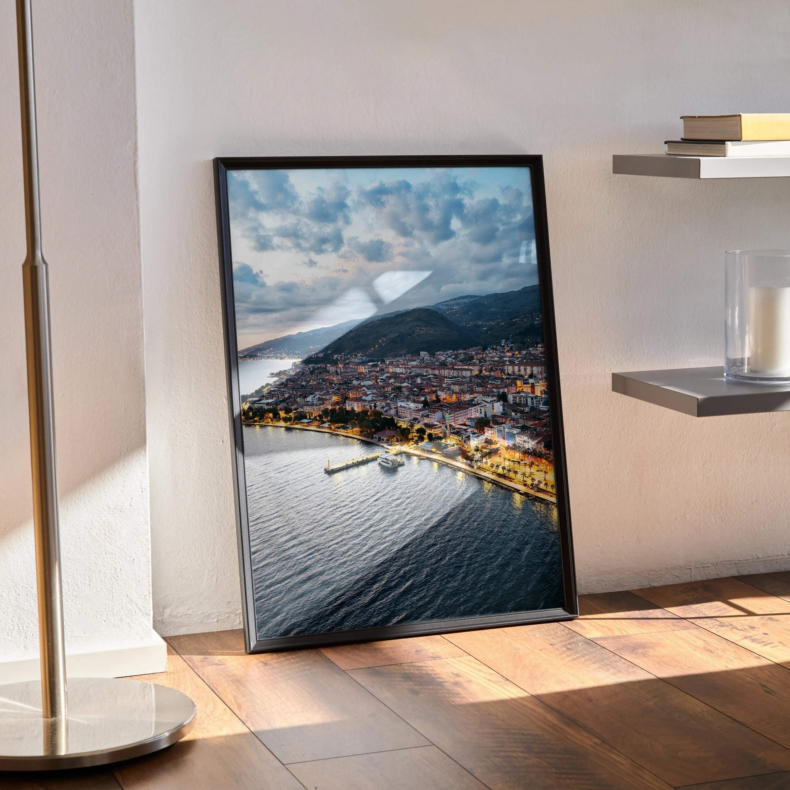 Vibrant city sunset wall art poster with coastal skyline and dramatic clouds in black frame.