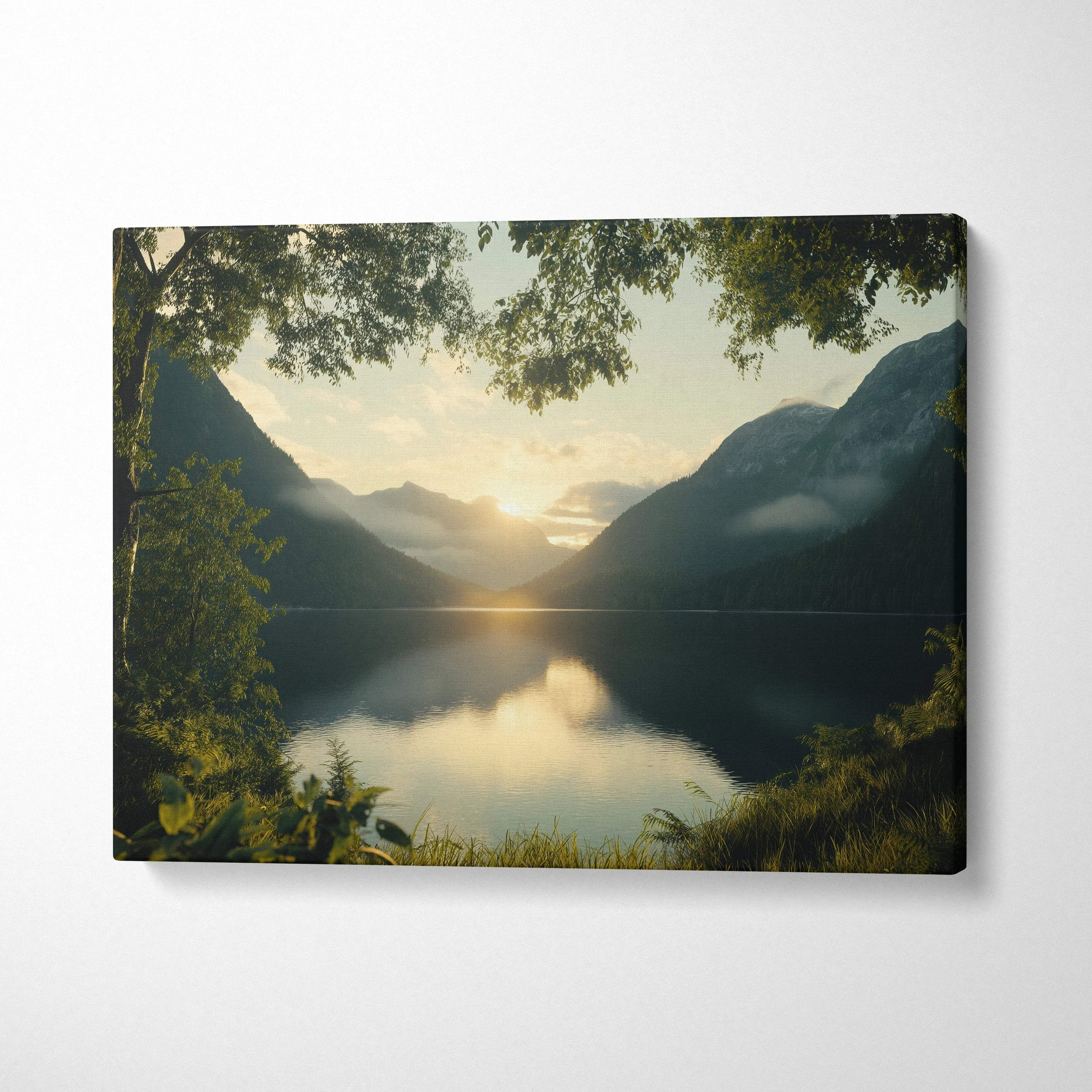 Serene canvas print of golden sunrise over tranquil lake amid misty mountains