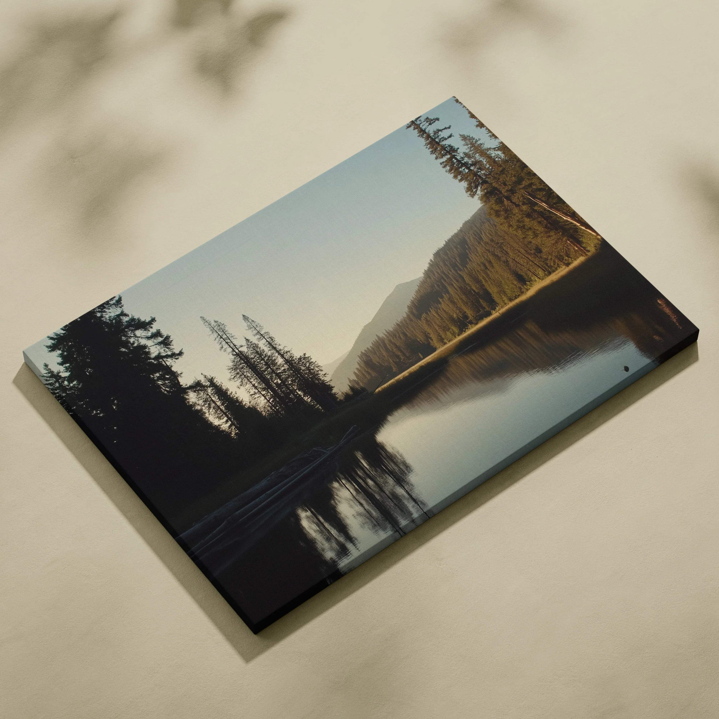 Serene canvas wall art of mountains behind forest lake in golden hour light