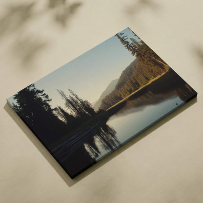 Serene canvas wall art of mountains behind forest lake in golden hour light