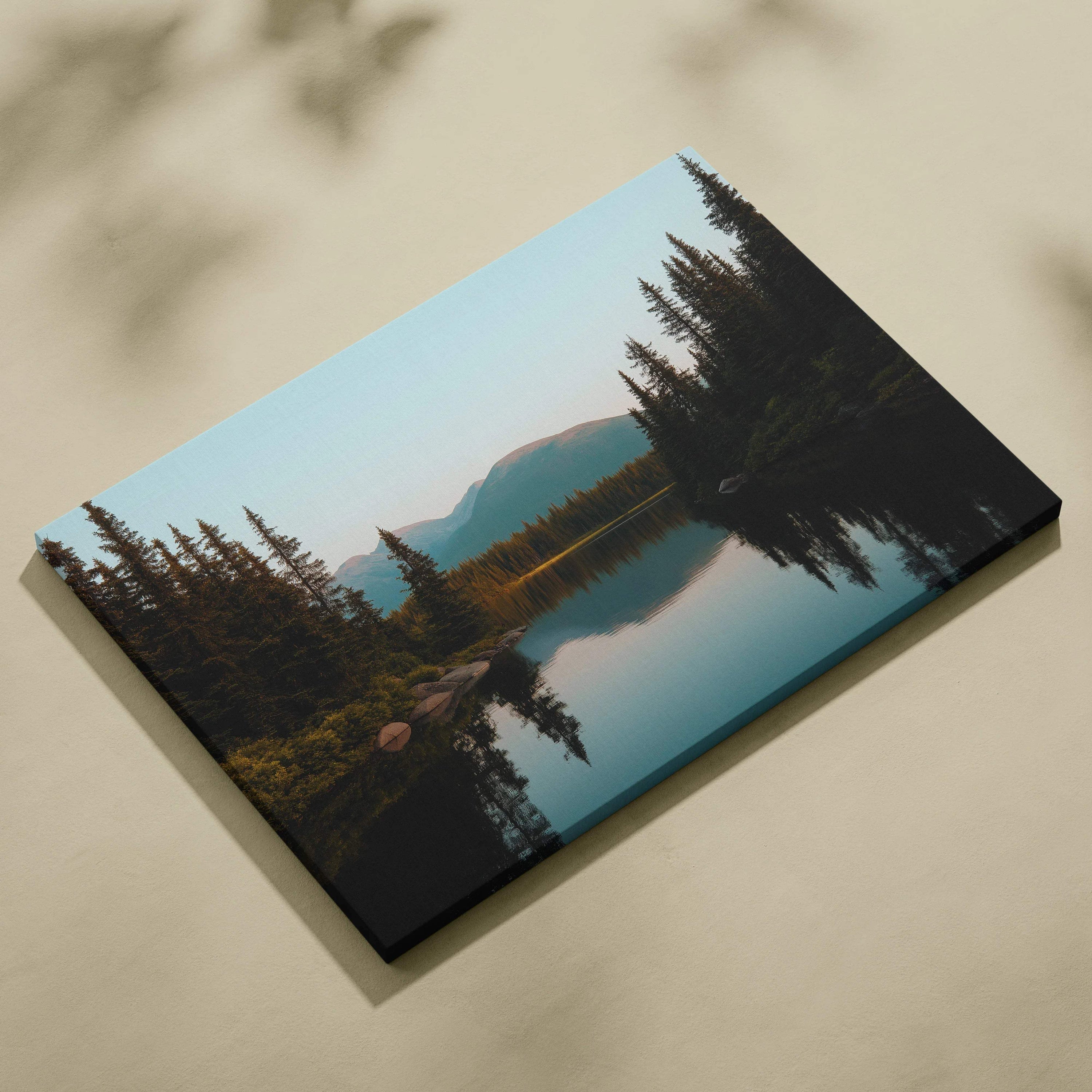 Serene mountain lake canvas wall art with evergreens and reflections