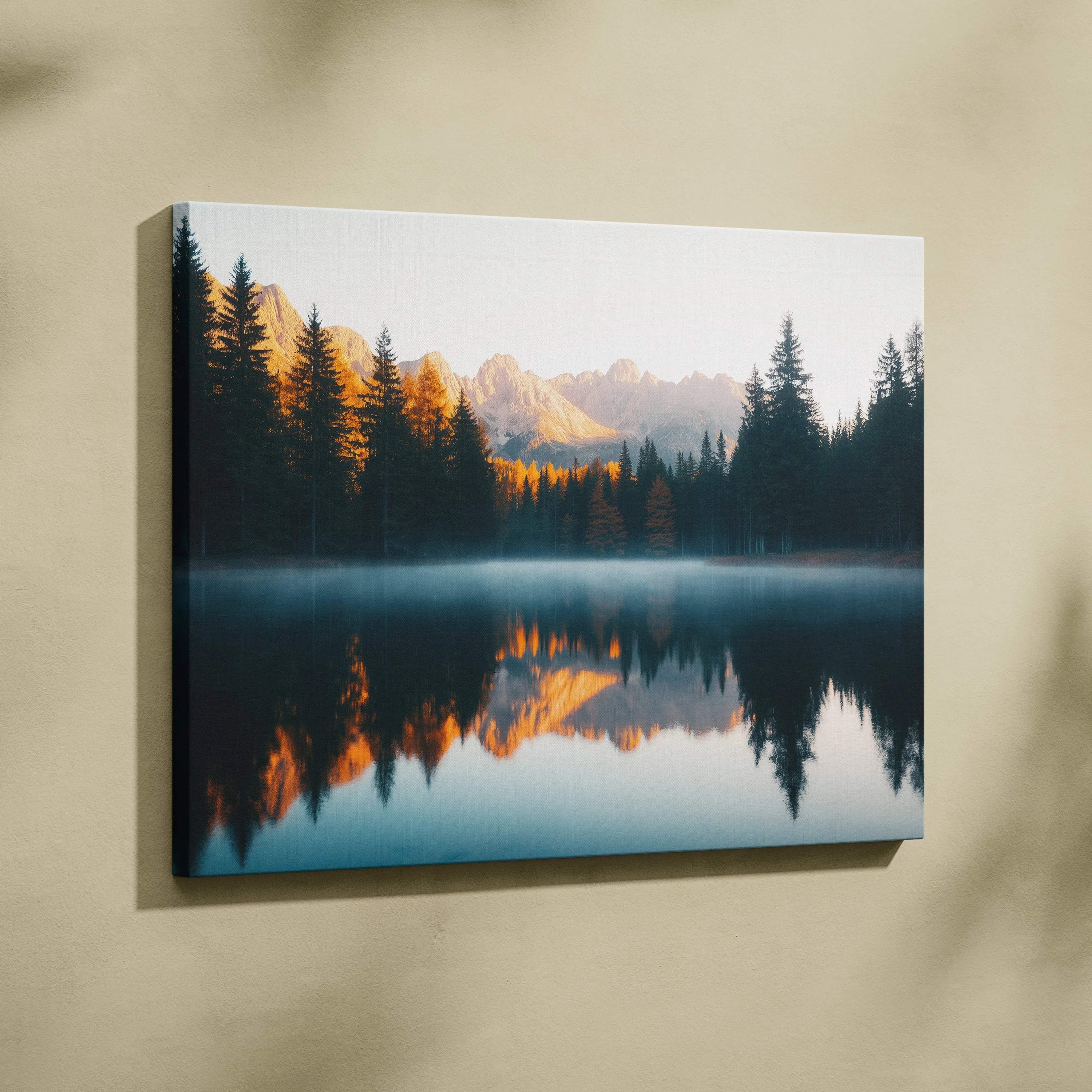 Canvas print of serene mountain lake with forest reflections at golden hour