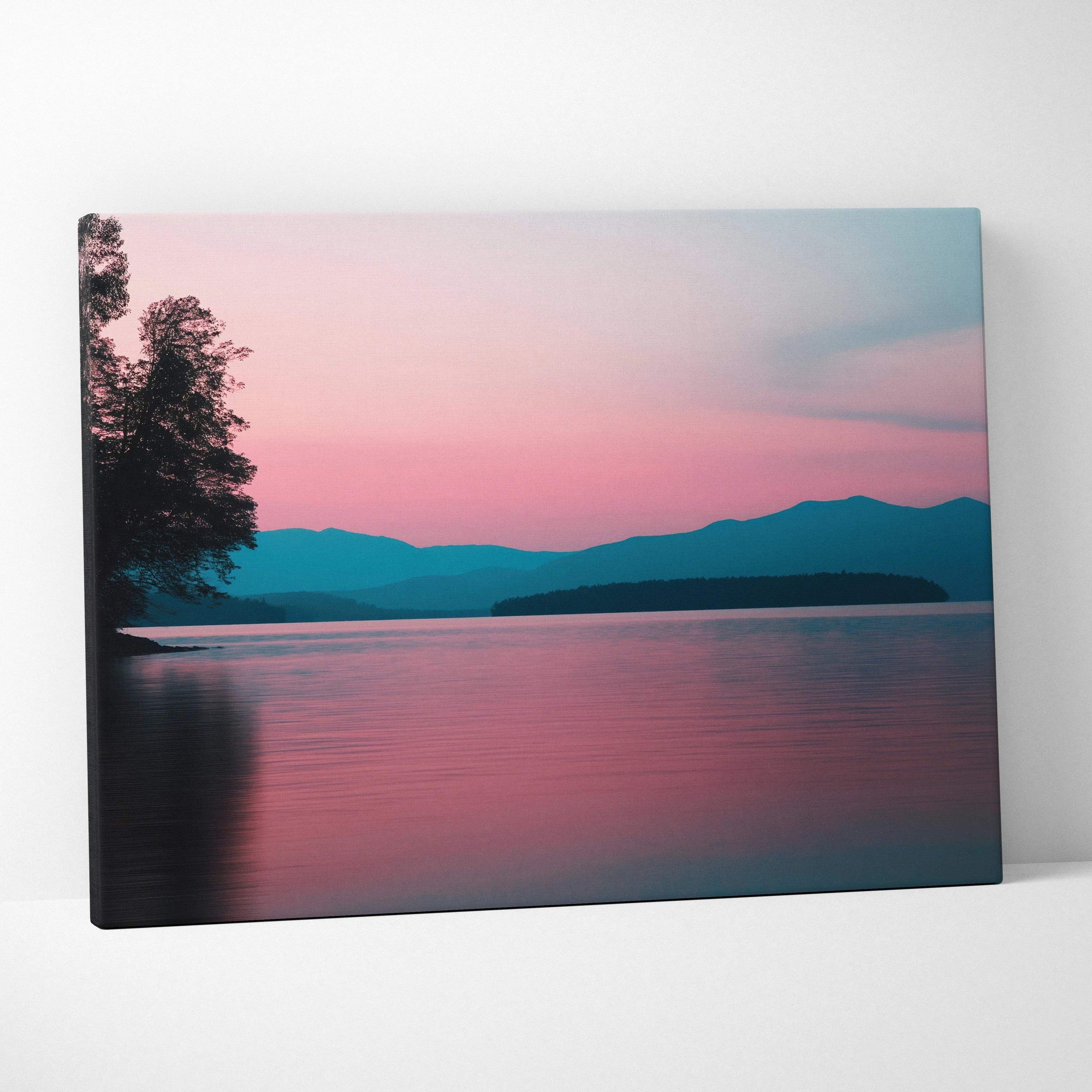Canvas wall art of serene lakeside sunset in pink blue tones with mountains