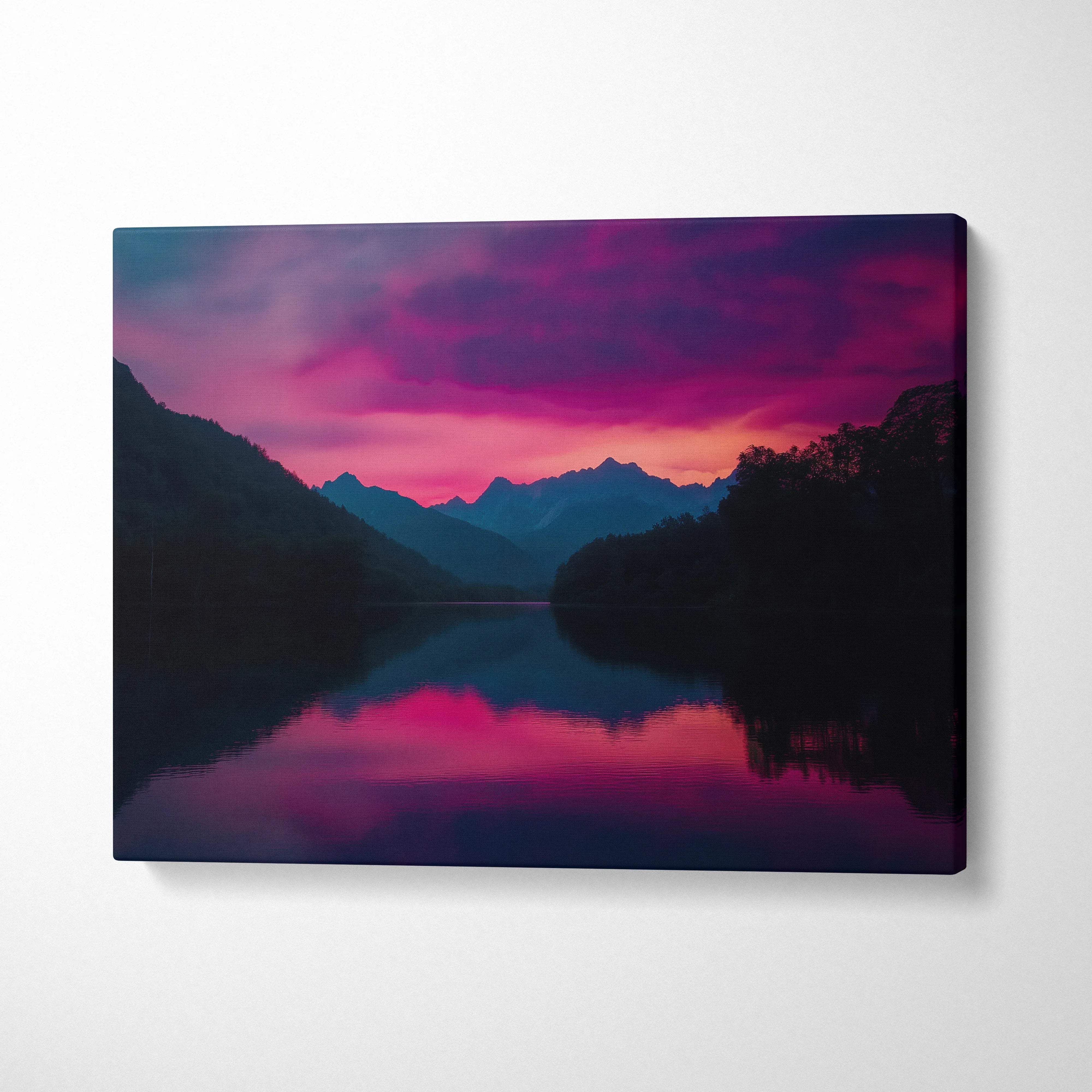 Canvas print of serene mountain lake at dusk with vibrant pink purple sky reflection