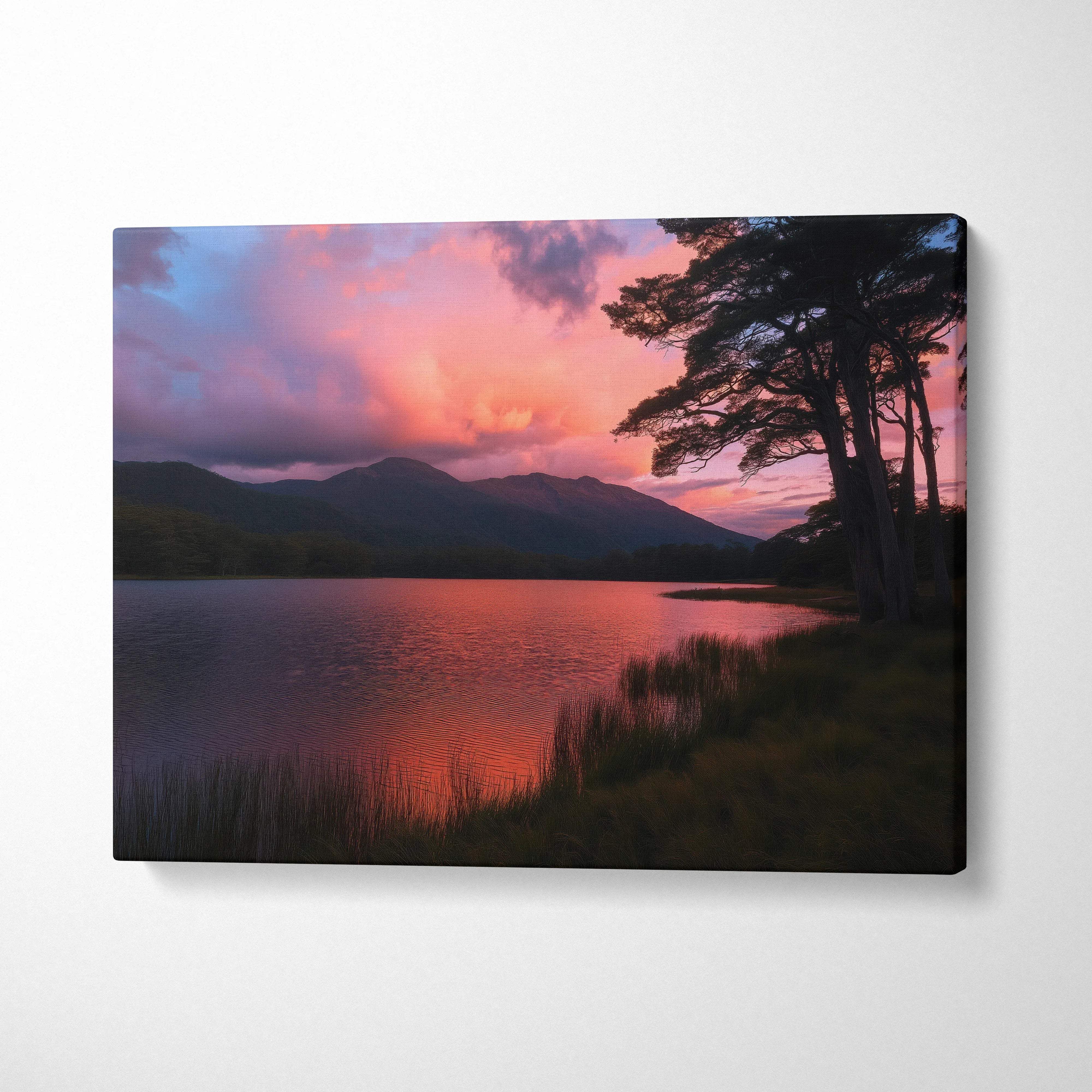 Canvas print of serene lakeside sunset with pink purple clouds mountains trees reflected in lake