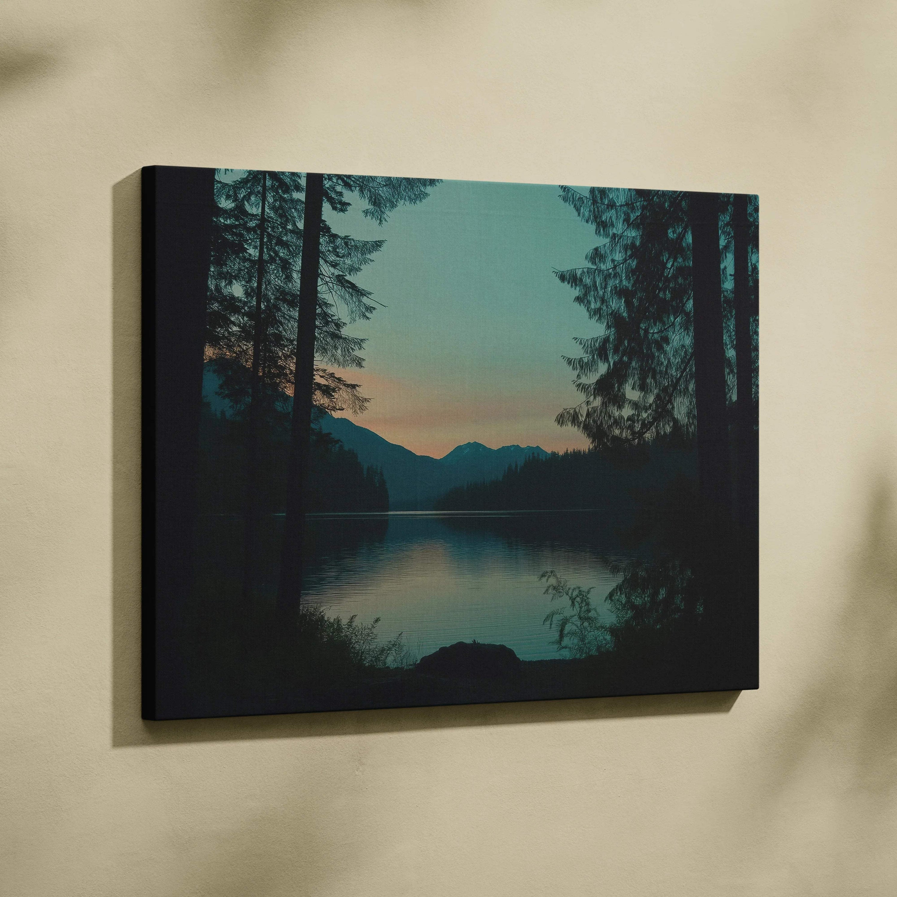 Canvas print of serene forest lake at dusk with mountains and sunset sky