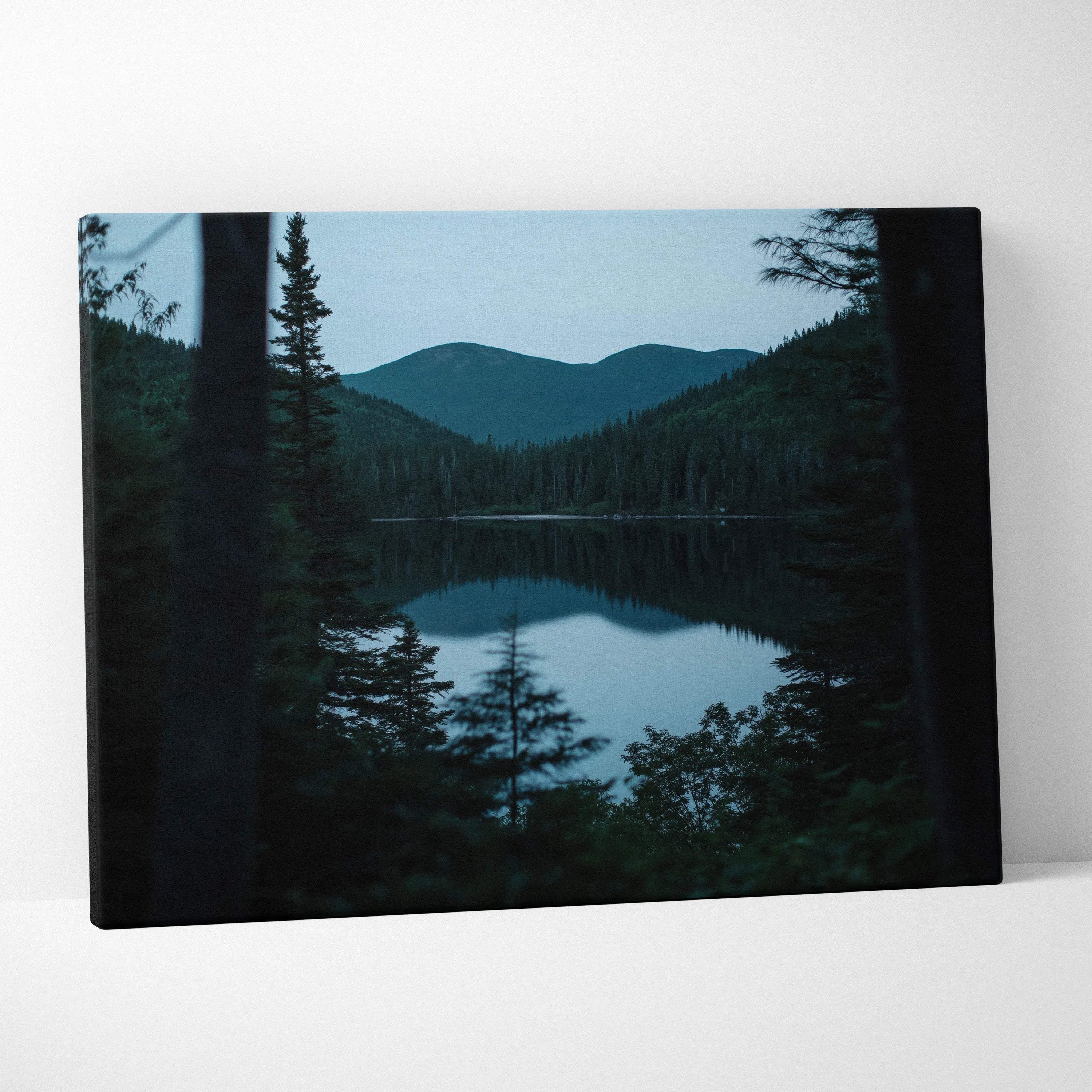 Canvas print of serene lake, pines, mountains at blue hour calm