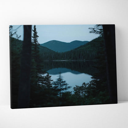 Canvas print of serene lake, pines, mountains at blue hour calm