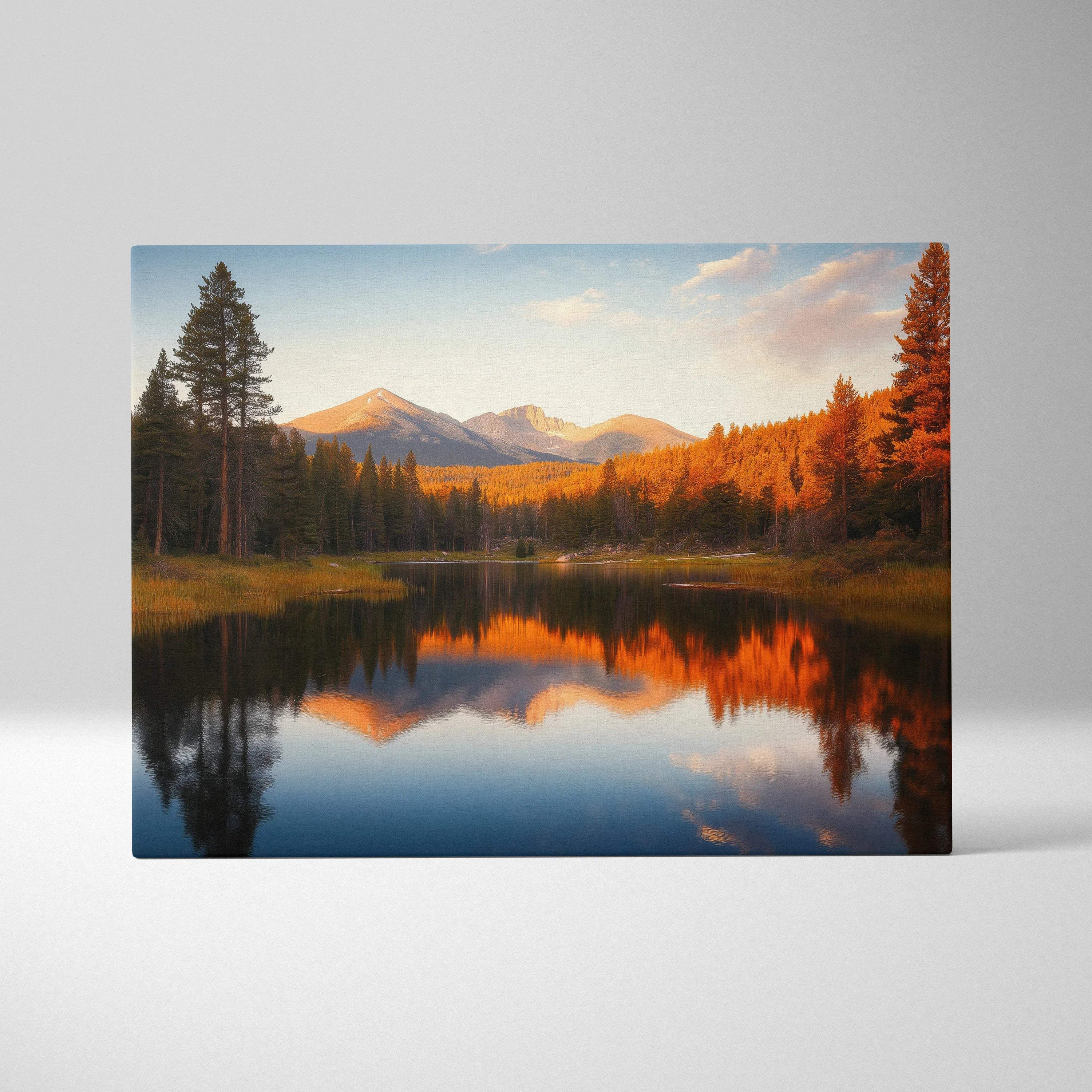 Canvas print of serene mountain lake with golden autumn trees and snow peaks