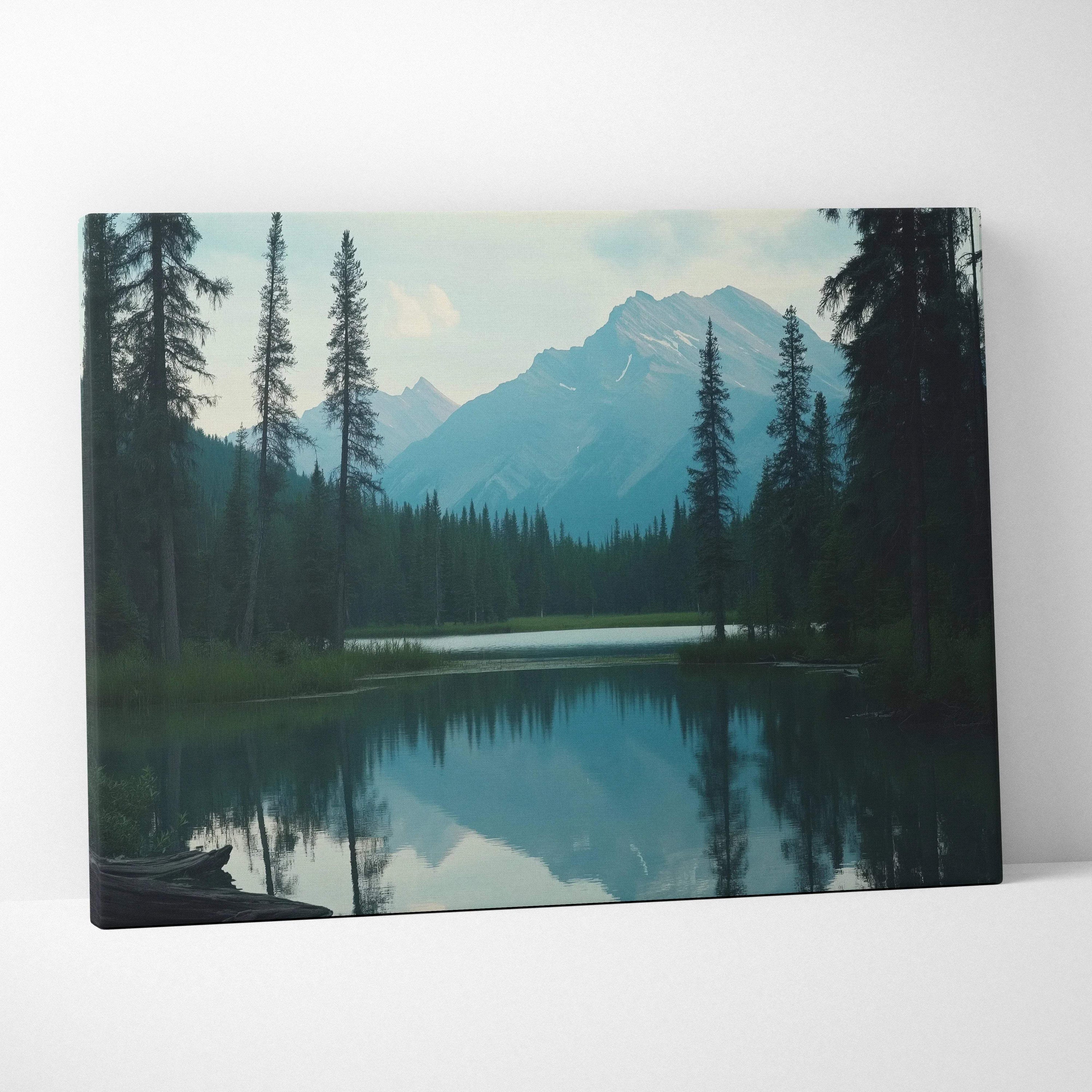 Canvas print of serene mountain lake with evergreens, snow peaks in calm blue tones