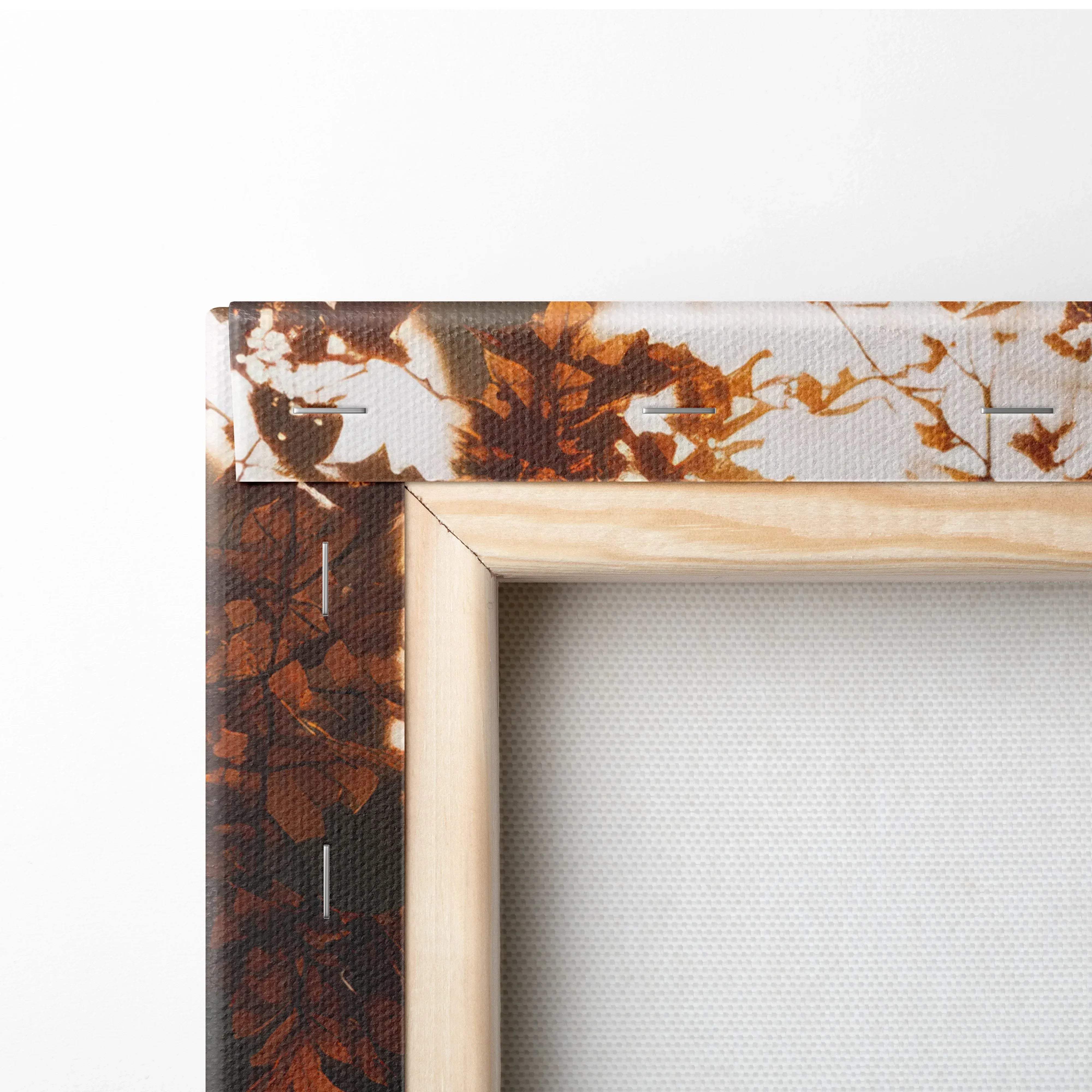 Light-colored wooden frame canvas wall art with autumn leaf pattern in brown and orange for warm serene home decor