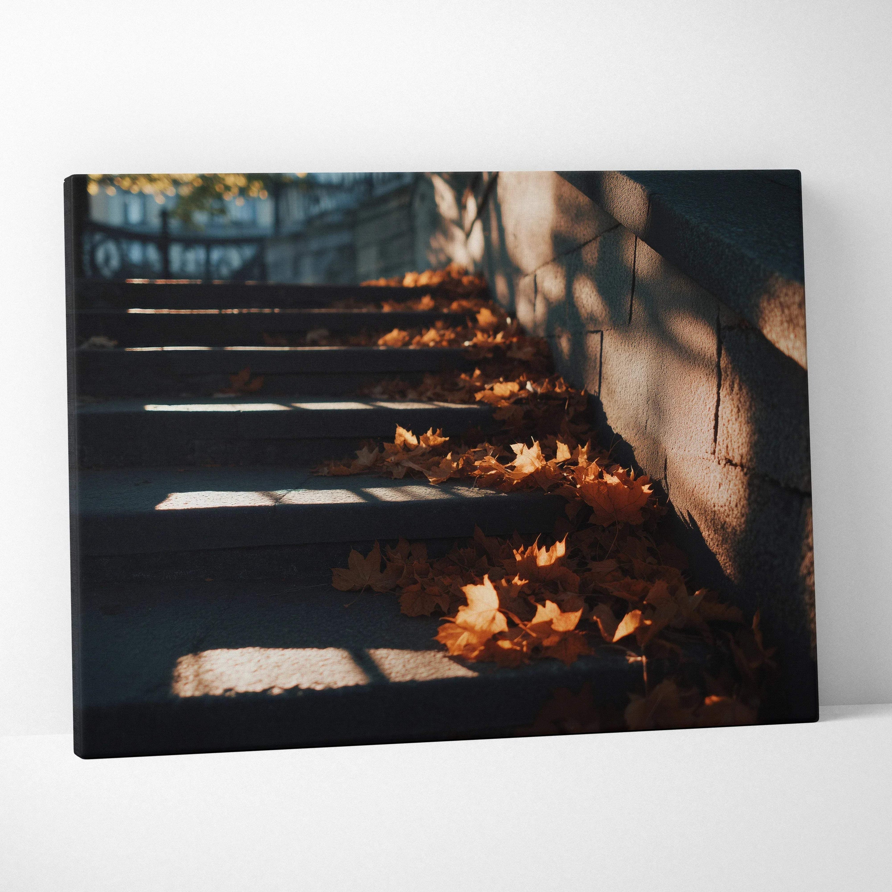 Autumn leaves scattered on shaded stone steps, canvas wall art with warm light and shadows.