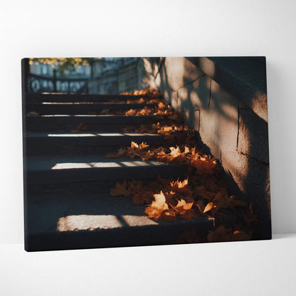 Autumn leaves scattered on shaded stone steps, canvas wall art with warm light and shadows.