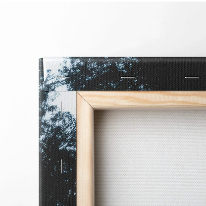 Corner detail of vibrant autumn nature canvas art with fall foliage and serene landscape, wooden frame edge visible.