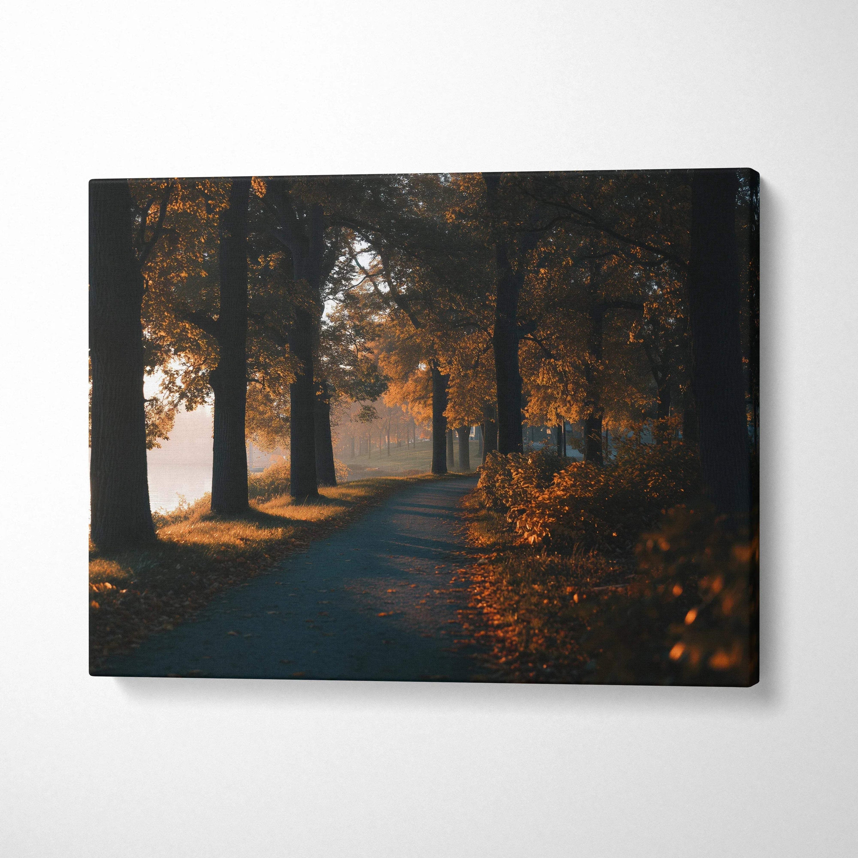 Autumn forest path with fall foliage in warm tones on horizontal canvas wall art.