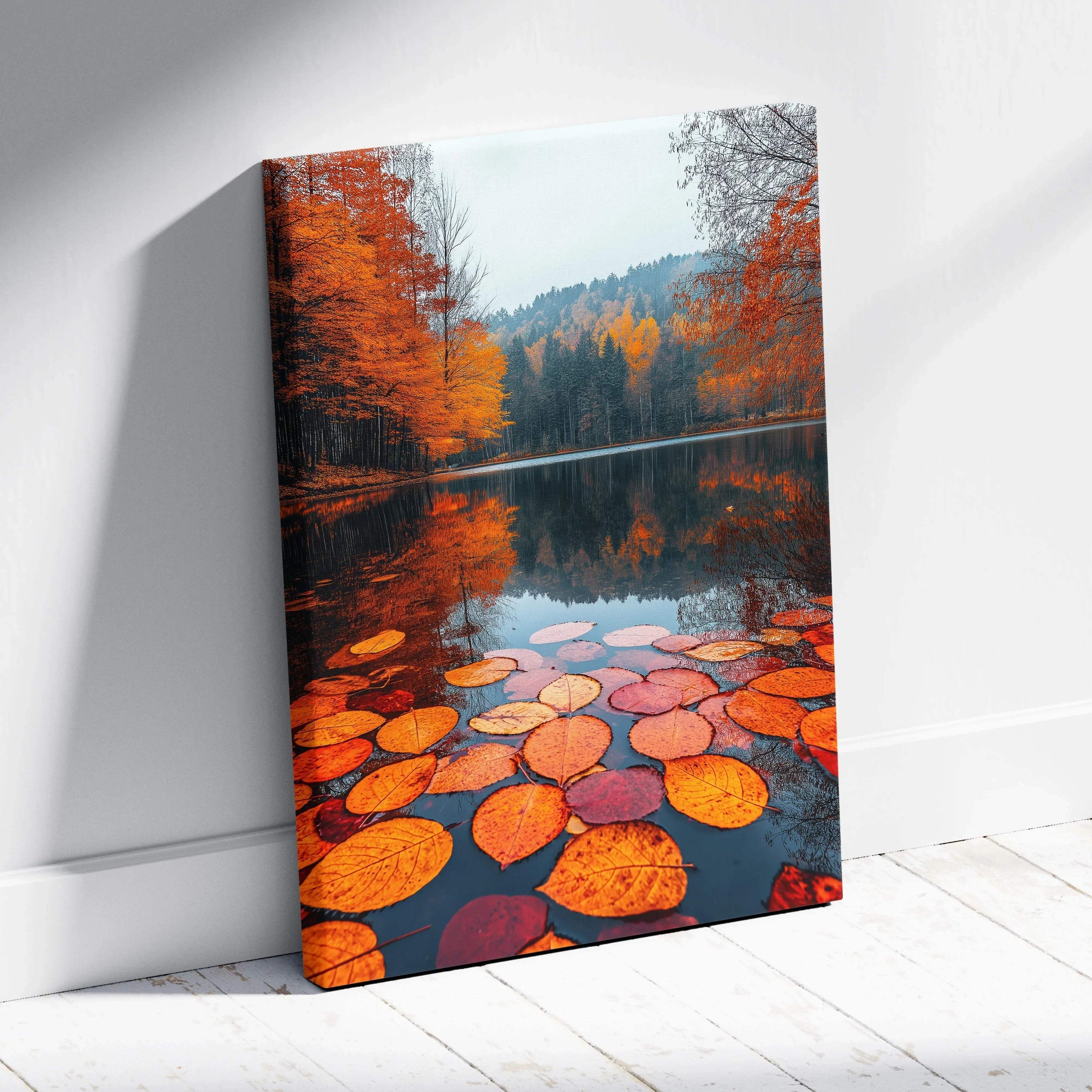 Autumn leaves floating on lake reflecting orange trees on serene canvas wall art.