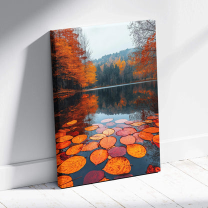 Autumn leaves floating on lake reflecting orange trees on serene canvas wall art.
