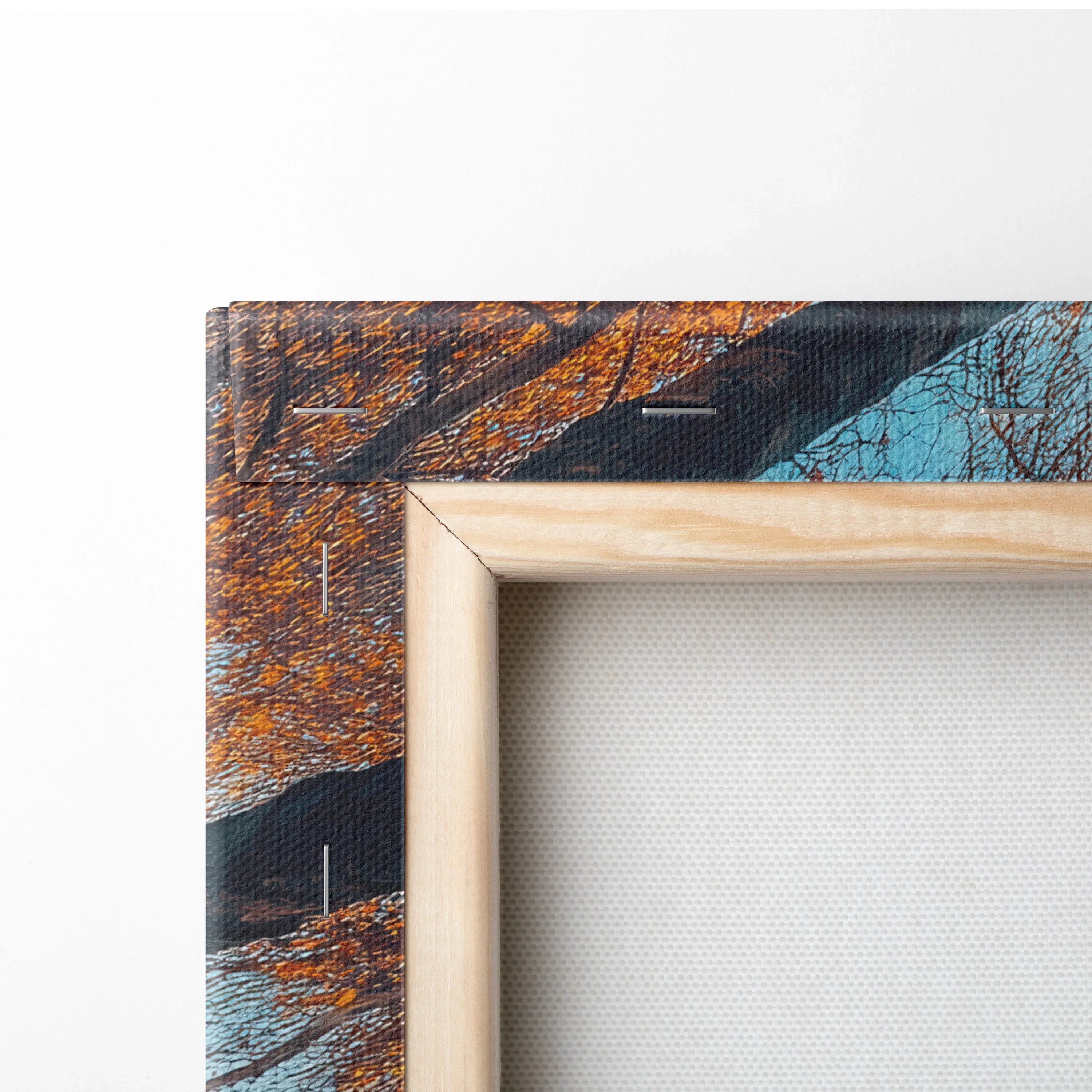 Close-up of autumn leaves and tree branches on vibrant nature-inspired canvas art with wooden frame edge.