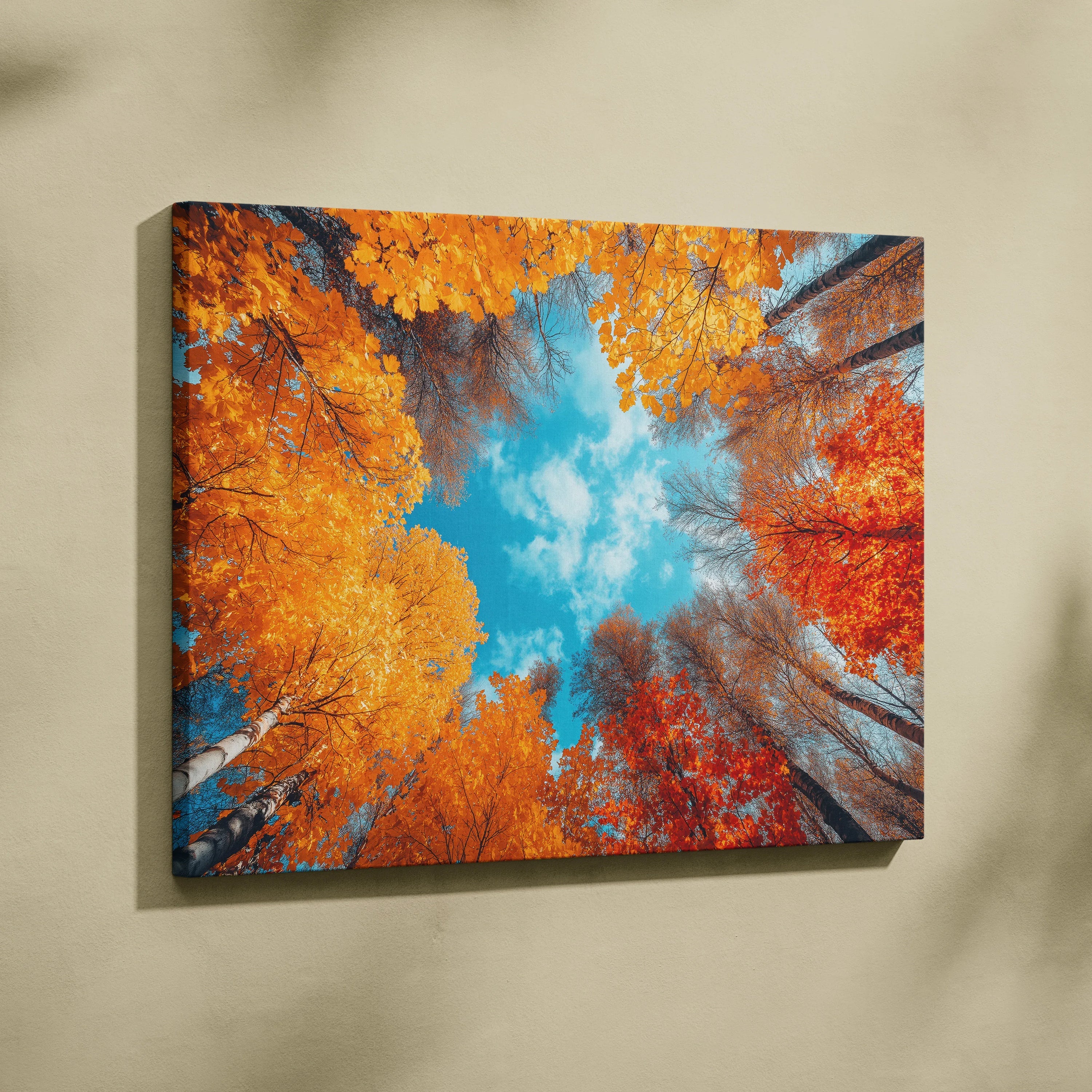 Autumn forest scene with vibrant orange and red leaves against bright blue sky on canvas wall art.