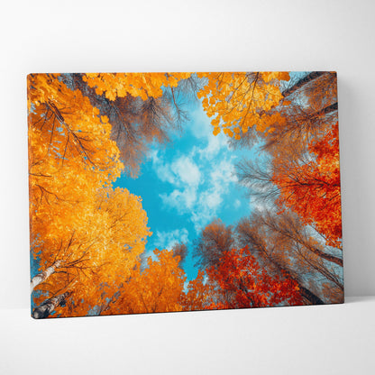 Autumn forest canvas art with vibrant orange and red leaves under bright blue sky wall art.