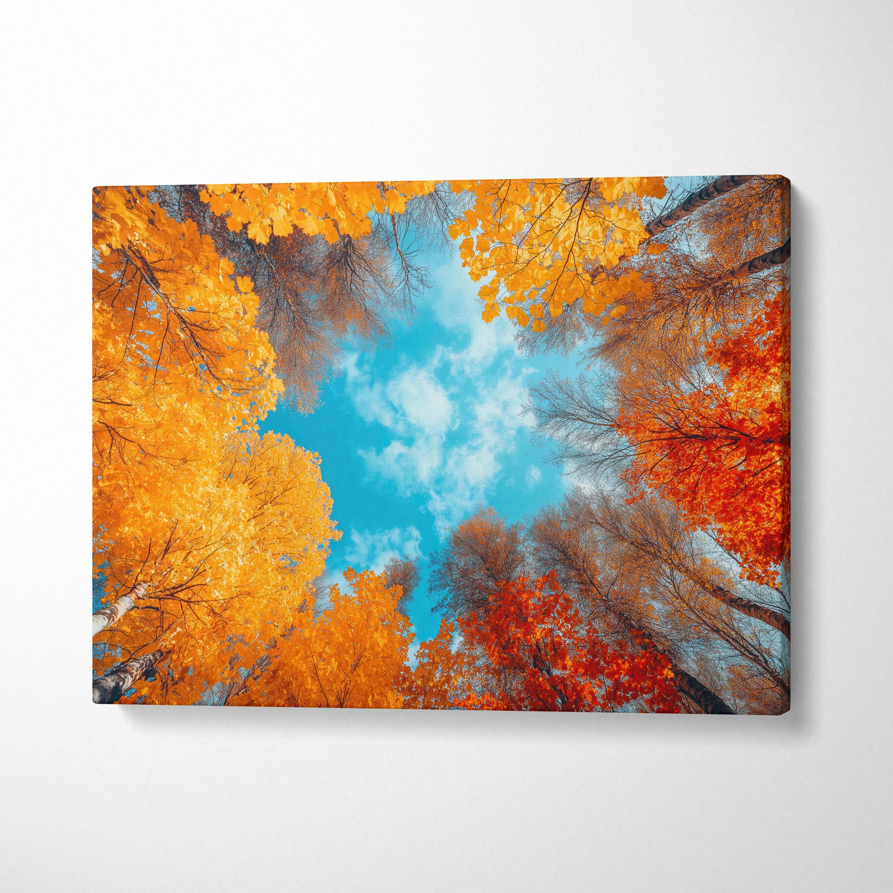 Autumn forest canvas art with vibrant orange and red leaves against a bright blue sky wall art.