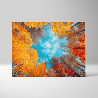 Autumn forest scene with vibrant orange and red leaves against bright blue sky on canvas wall art.